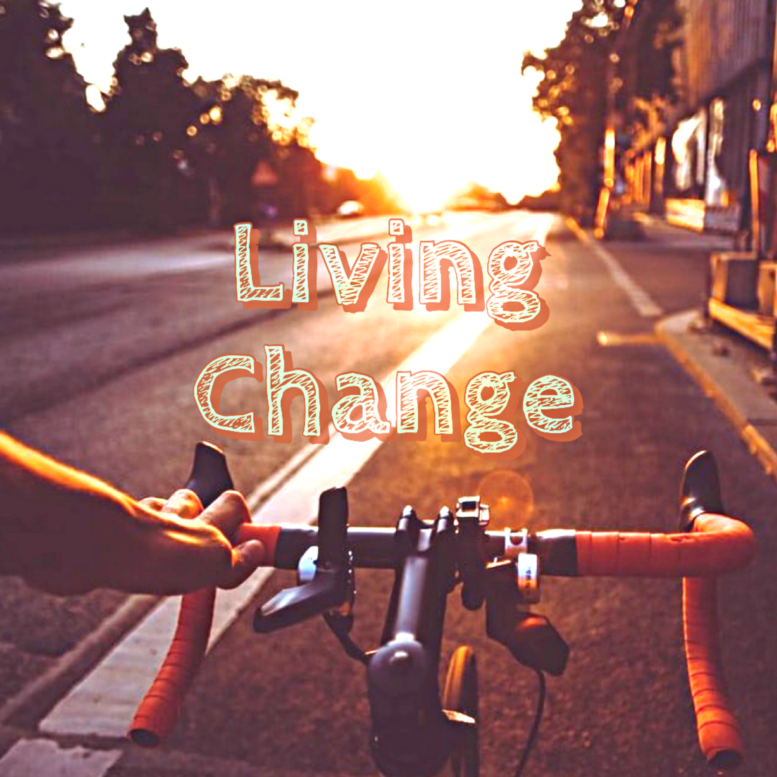 Bicyclist faces an open road with text: Living Change