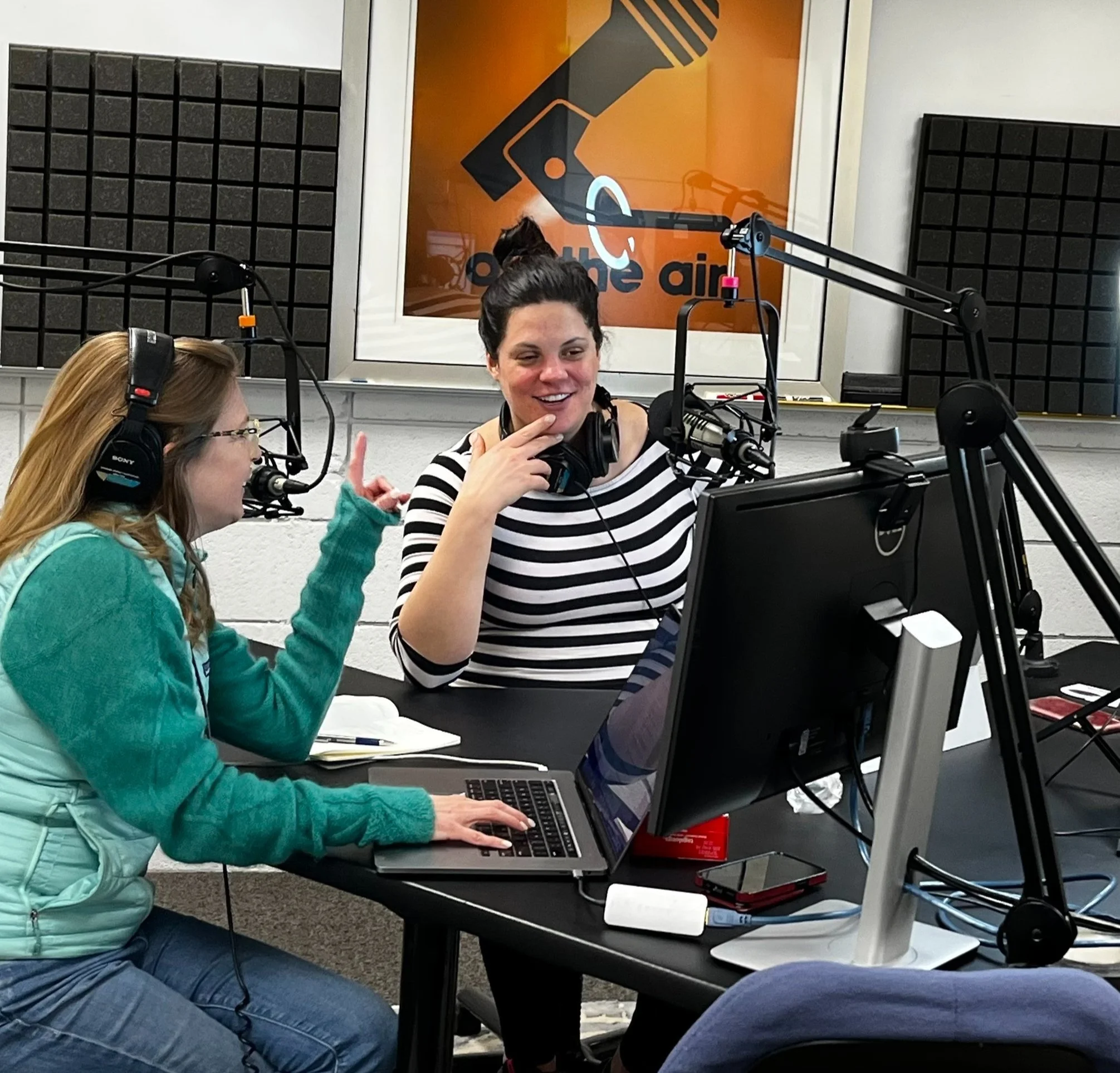 Producer Tina Nole talks with host Andrea Dunlop in Larj Media's podcast studio in Seattle.