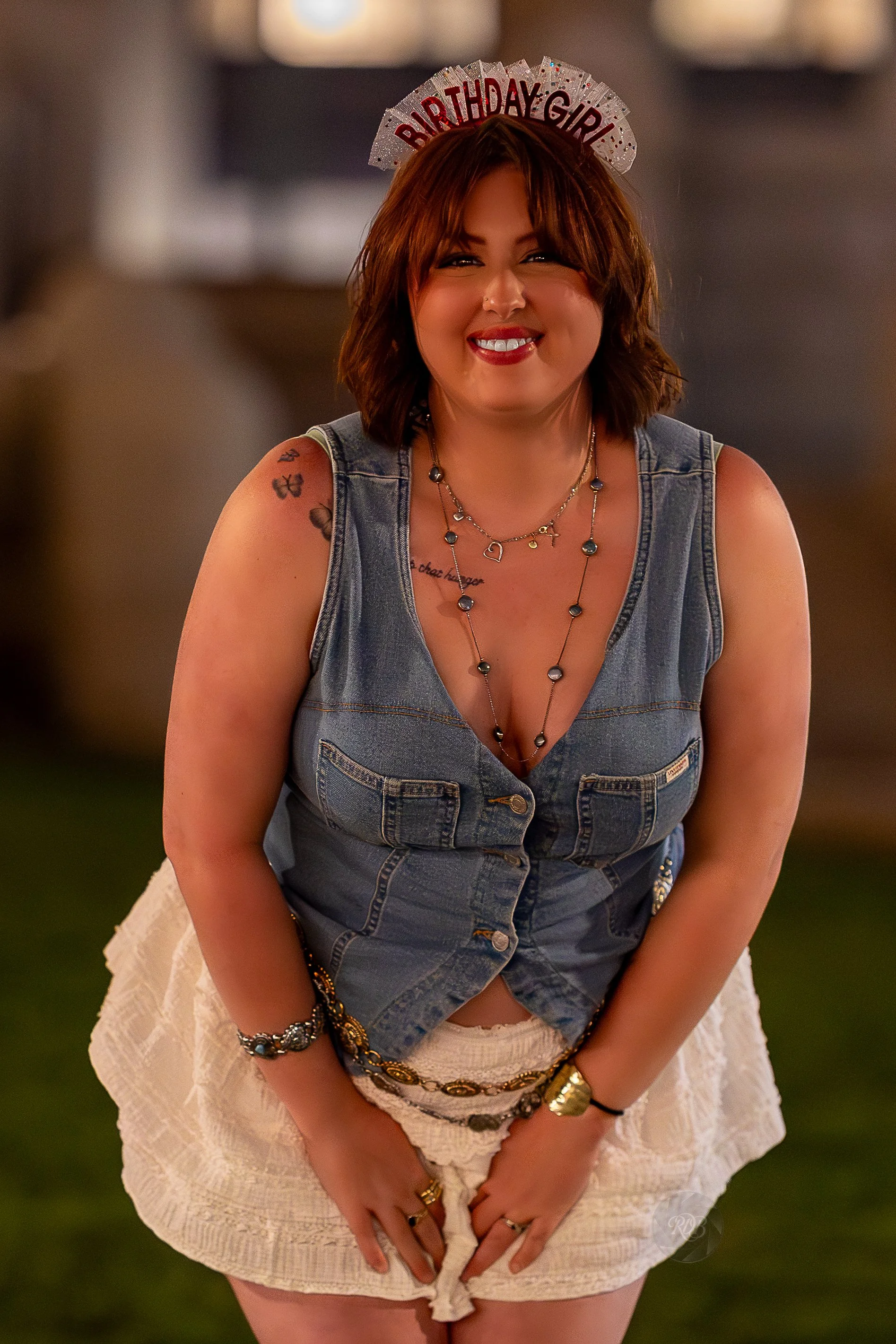 A woman with shoulder-length brown hair wearing a 