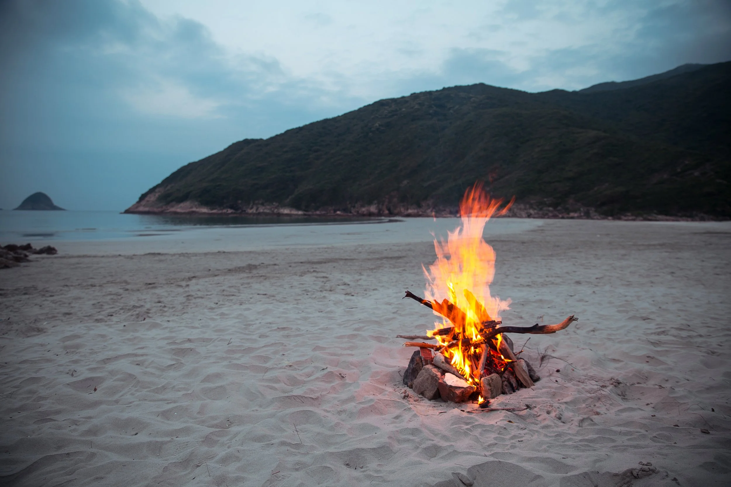 A charcoal fire on the beach