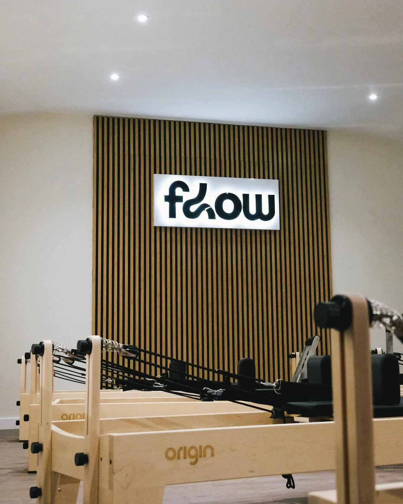 Illuminated signage for @flow.fitness.dorset and @flow.reformer.dorset 

Backlit Perspex letters mounted onto sign trays, creating a strong focal point within the main areas of both studios.

The sign trays keep all wiring safely contained while allo