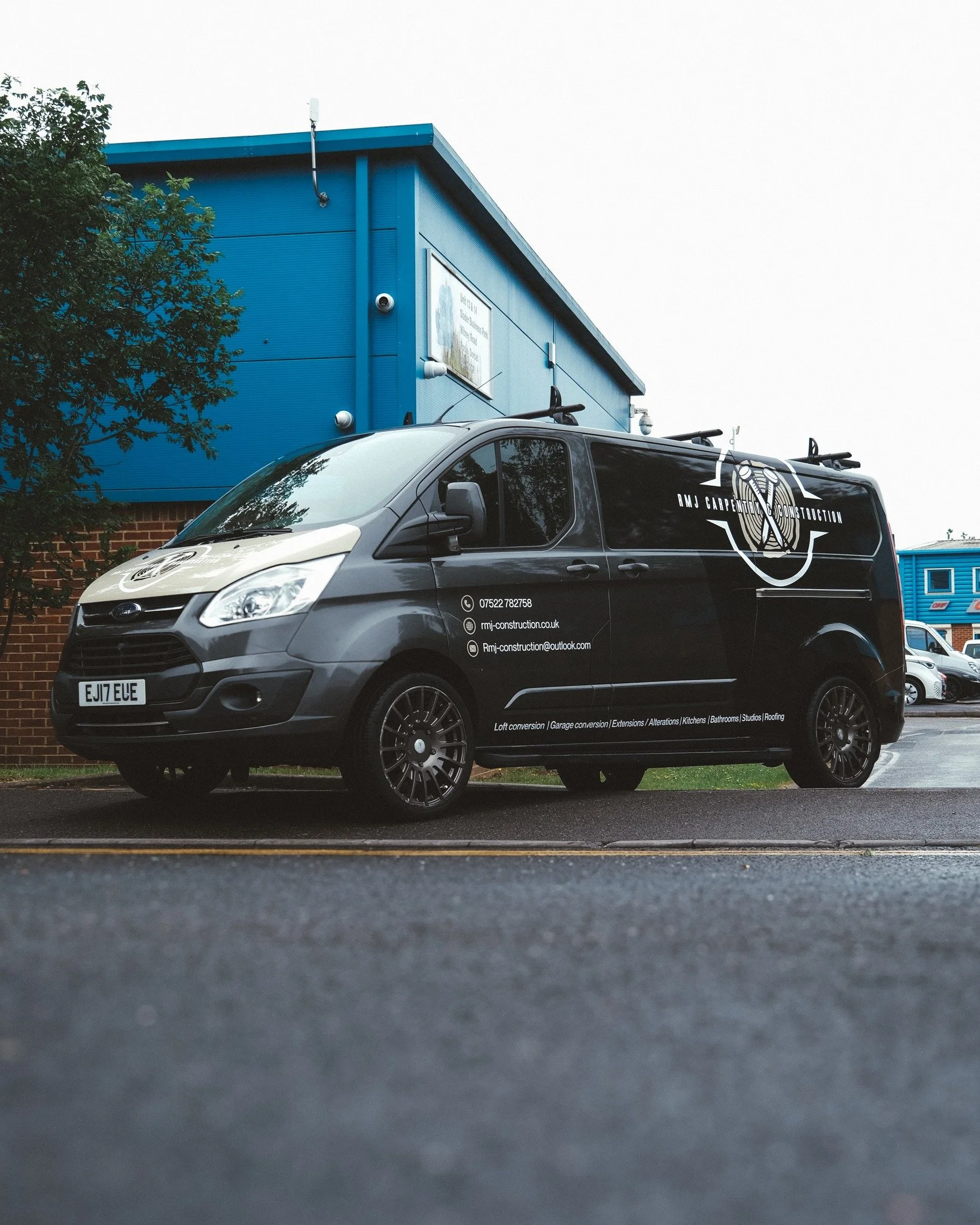 Subtle by design.

Transit Custom branding completed for RMJ Carpentry &amp; Construction, using gloss metallic black against the anthracite metallic paintwork for a subtle but noticeable colour change.

Finished with a gloss cream and sand coloured 