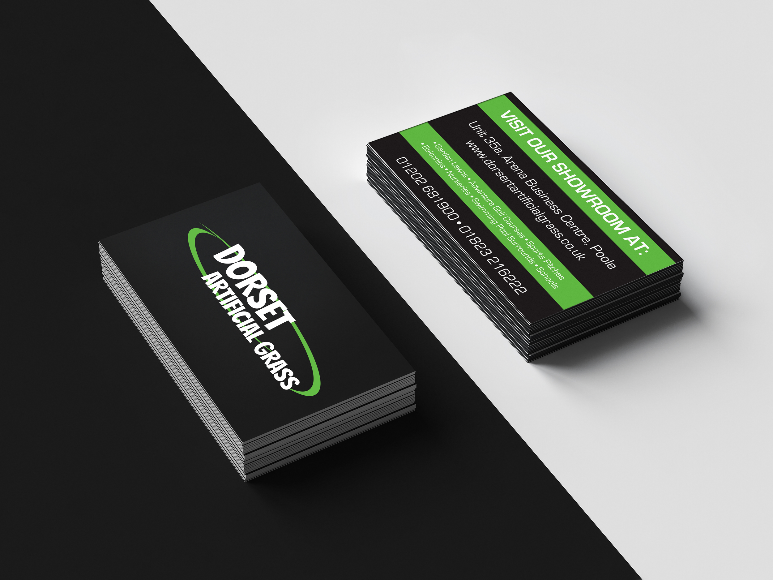Stack of business cards for 'DoorSheet,' with a black background, white and green text, and a phone number.
