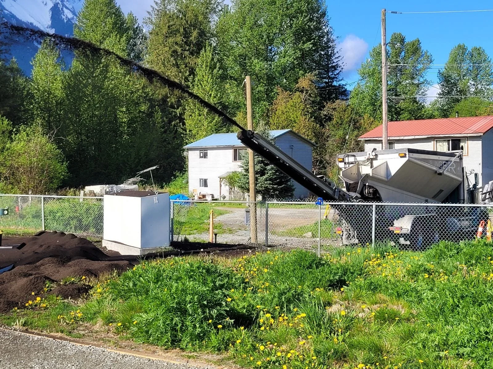 Soil being distributed across landscaping project