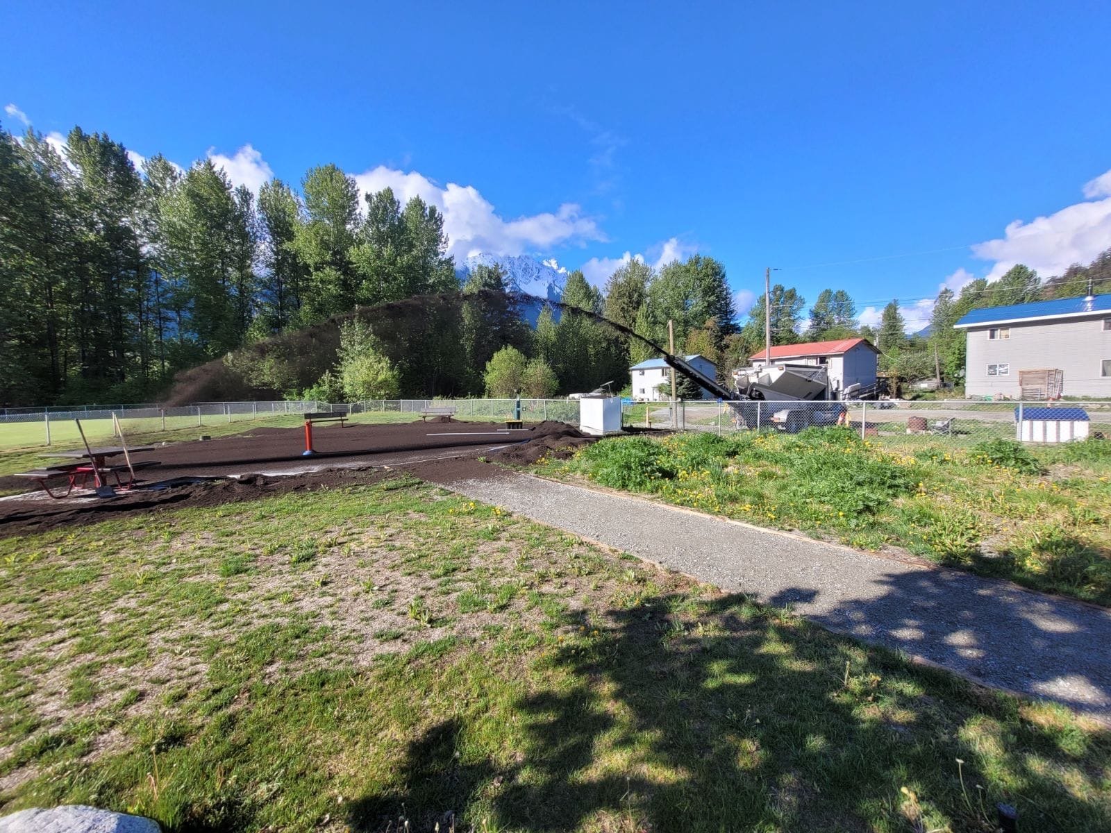 Soil being distributed across landscaping project