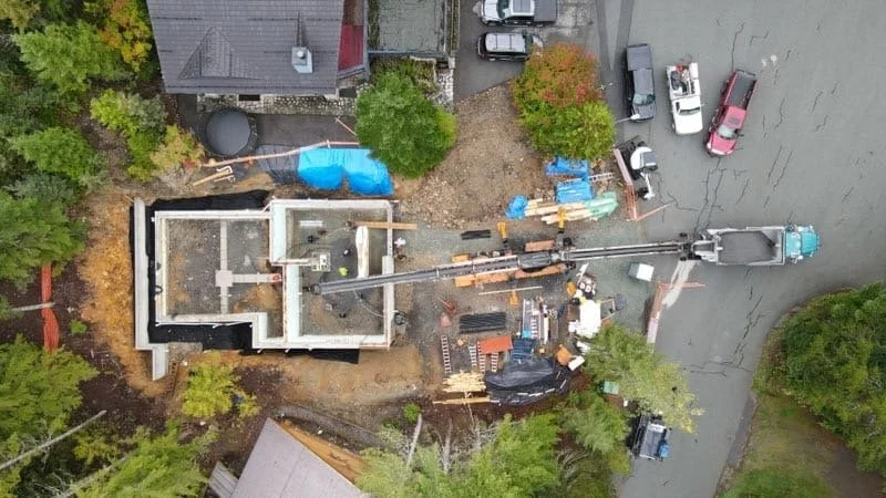 Wide view of construction site during material placement.