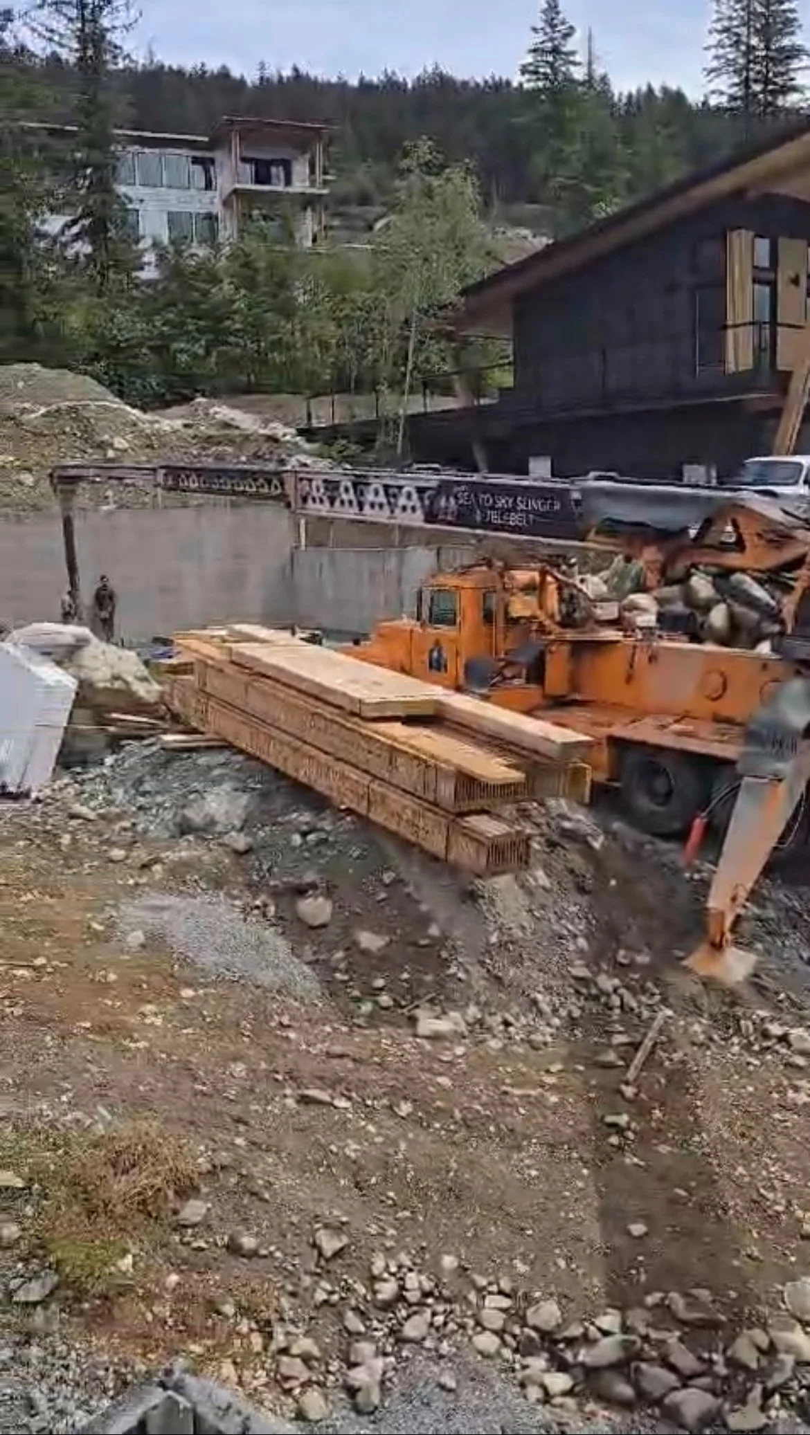Telebelt placing materials on residential build site in Whistler.