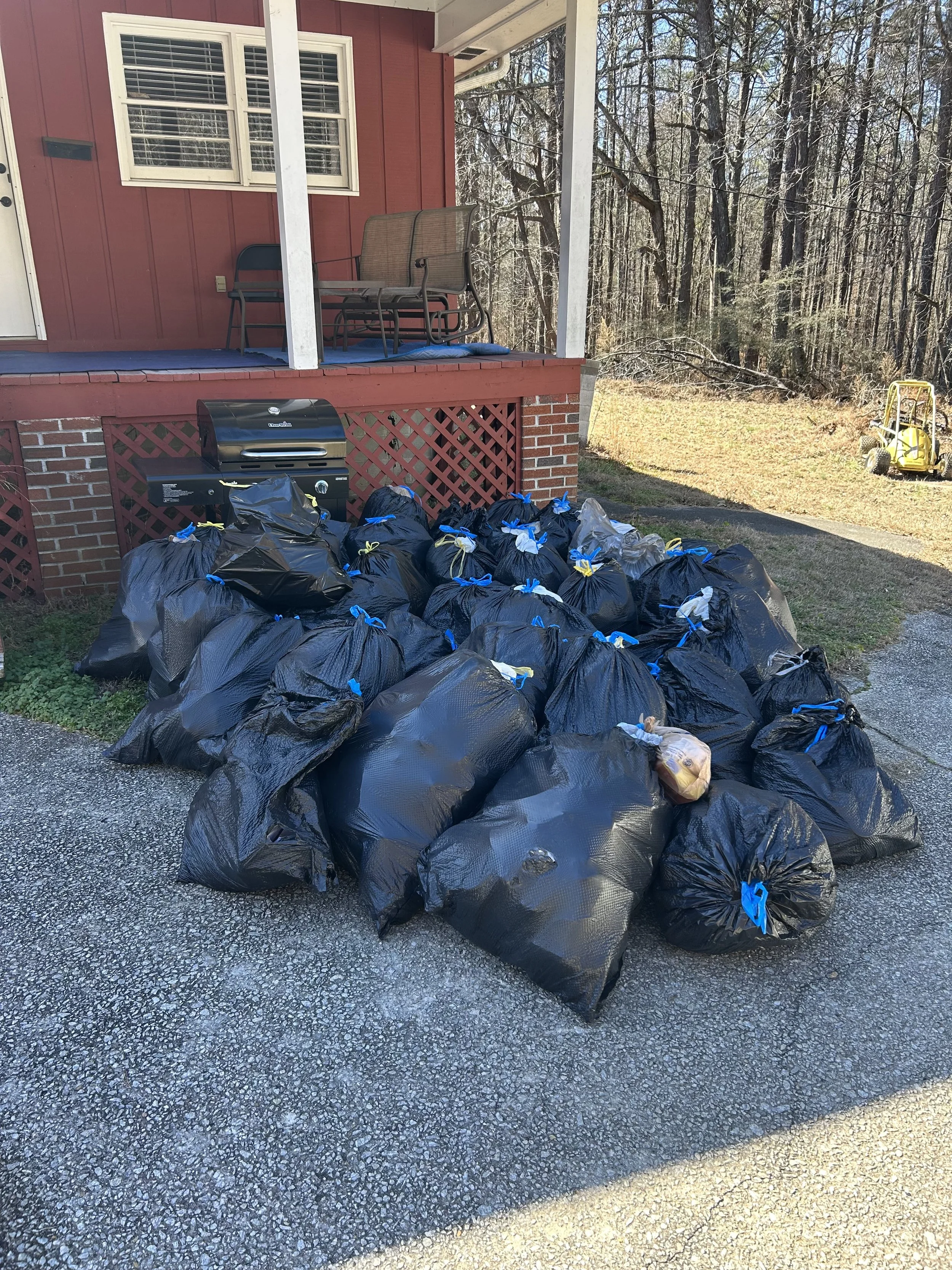 Outdoor junk removal in Douglasville GA clearing yard debris, furniture, and renovation waste
