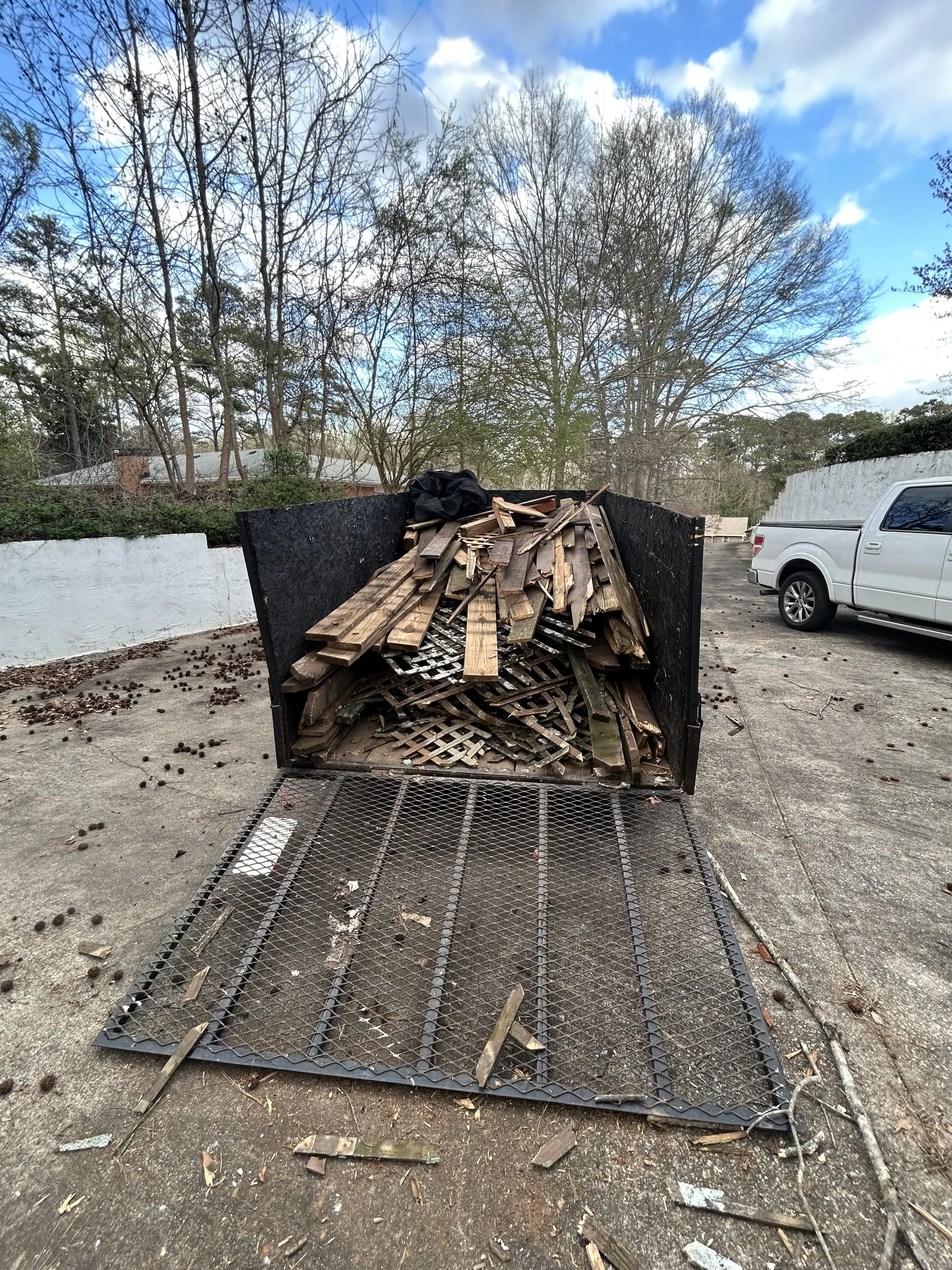 Before and after junk removal in Douglasville GA showing full property cleanout transformation