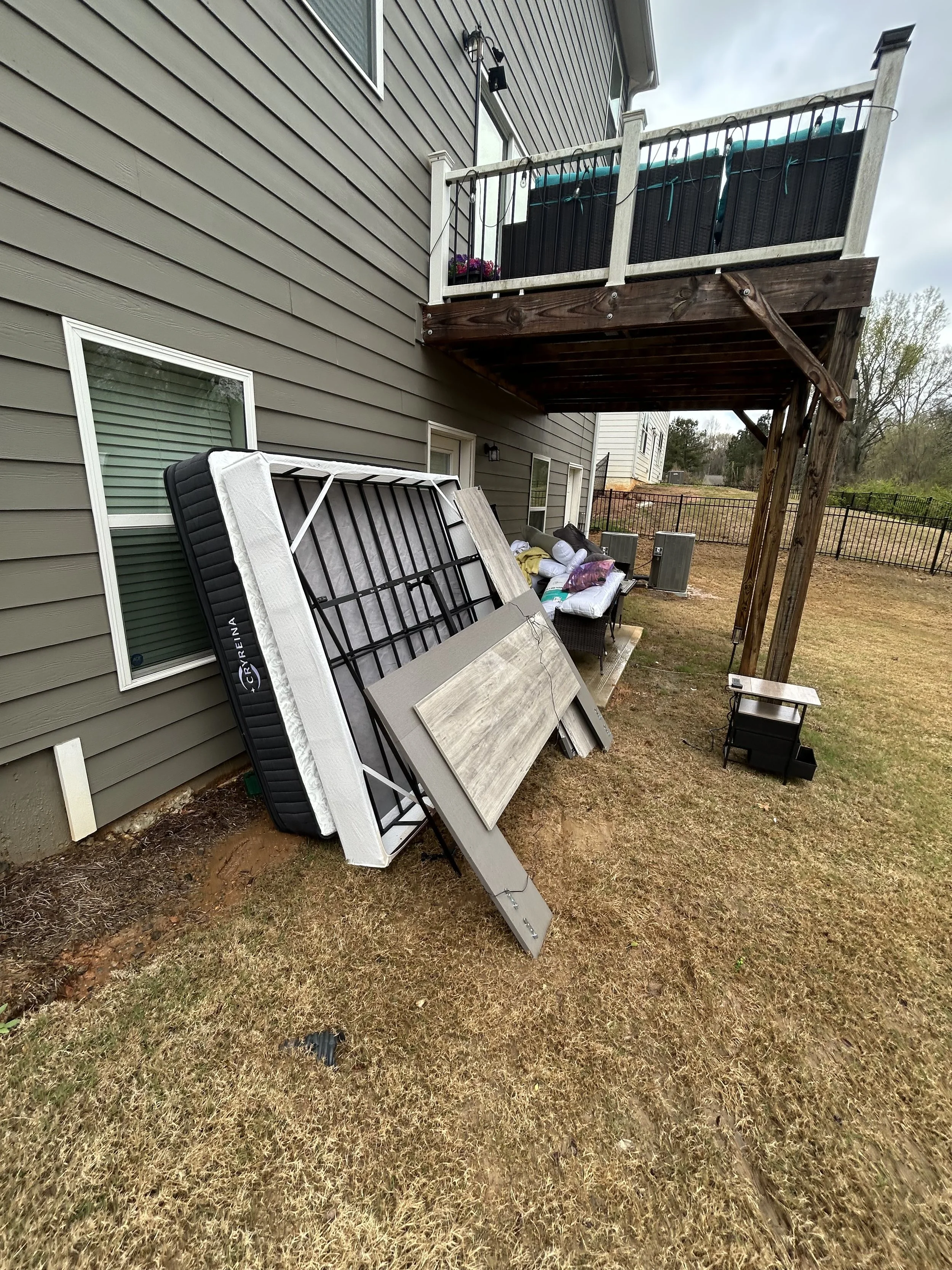 Before and after junk removal in Douglasville GA showing full property cleanout transformation