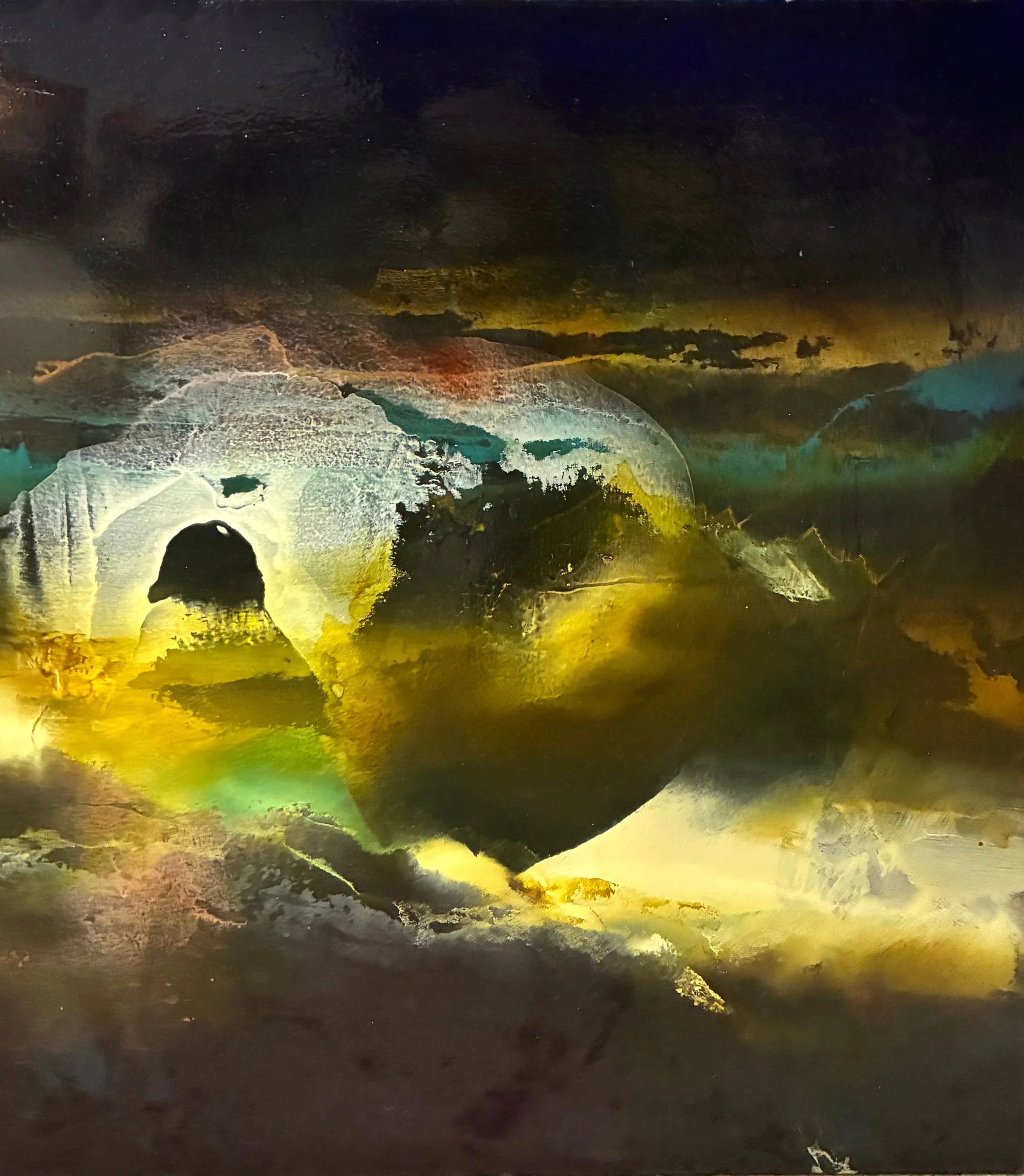 Abstract painting of gold, black and hints of orange and teal