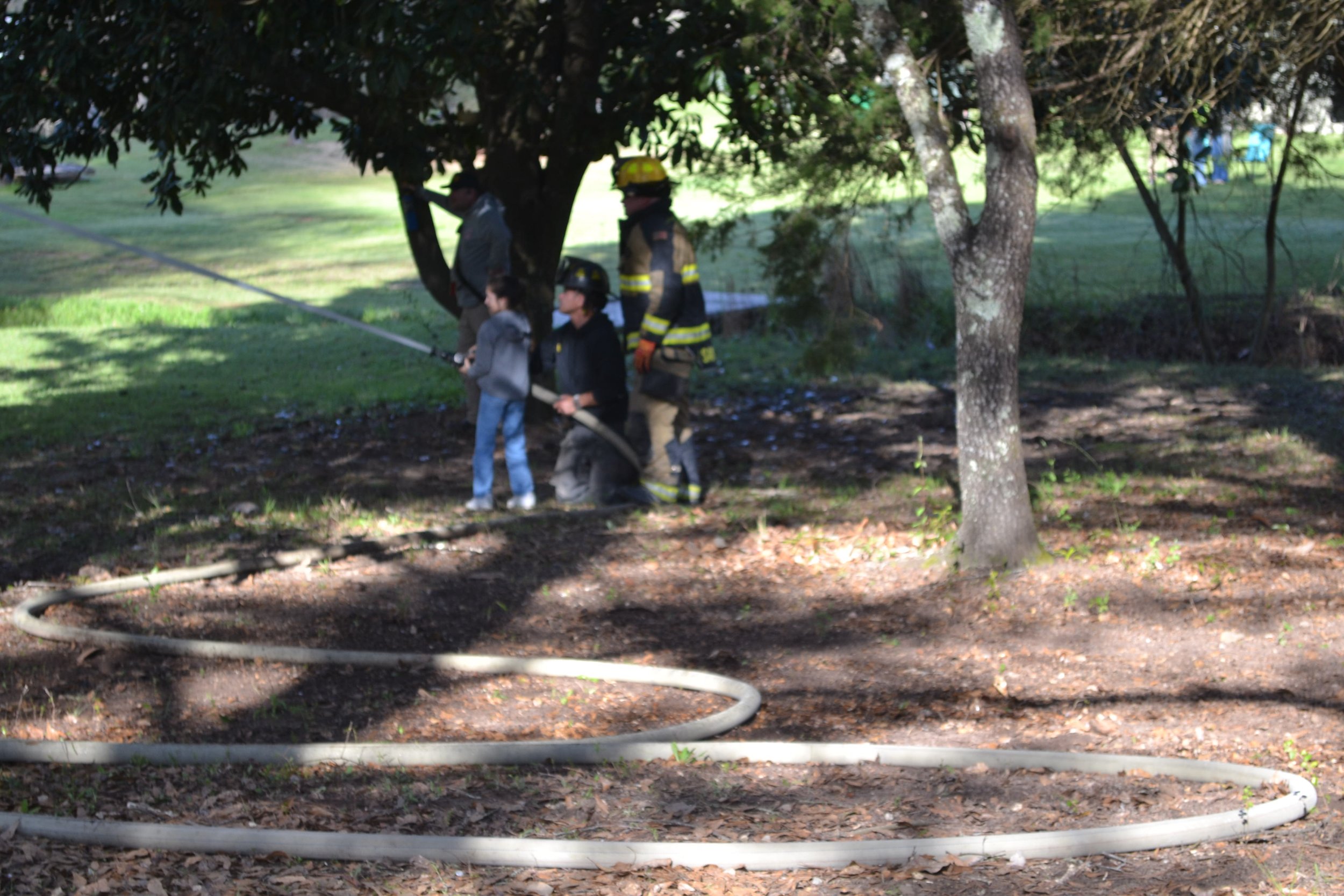 Firefighters Take time to demonstrate how to use a nozzle.