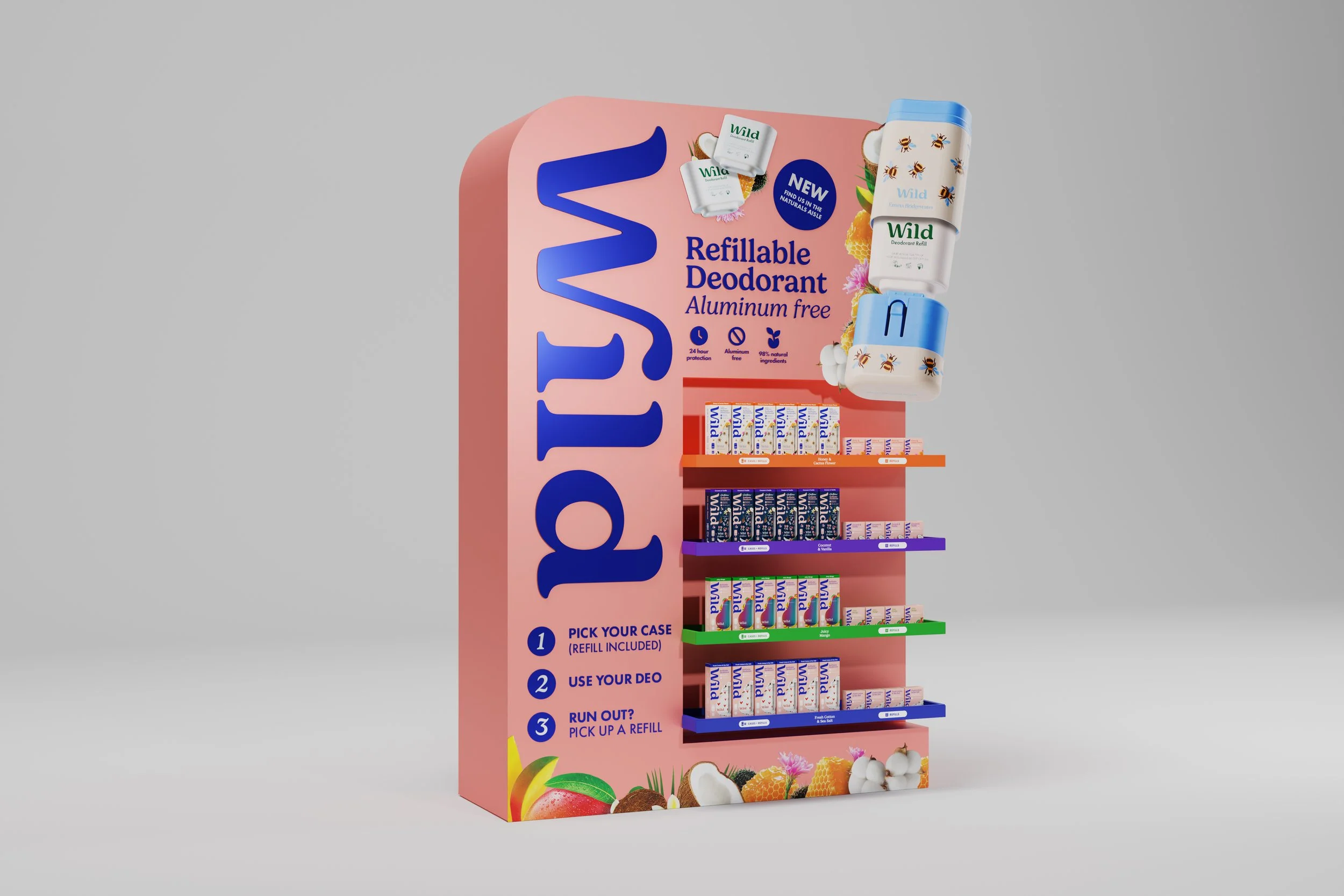 Display of Wild brand refillable deodorant products on a colorful stand, featuring multiple deodorant cases in blue, pink, purple, green, and blue, along with a sign promoting refill and usage instructions in a retail setting.