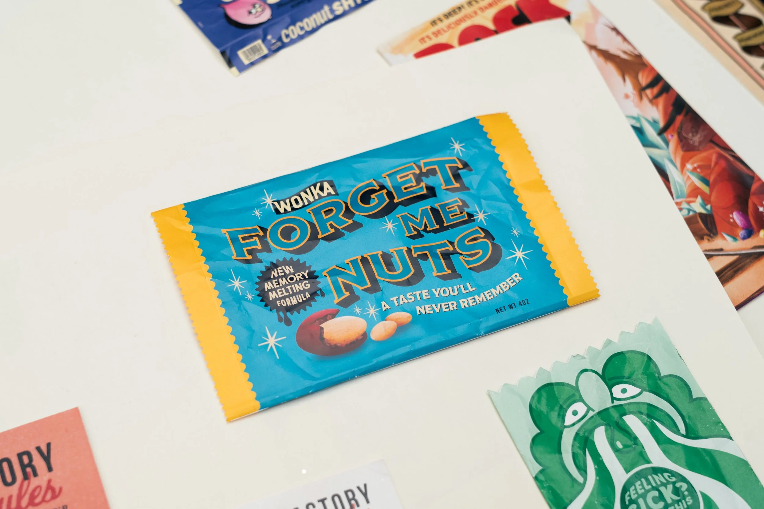 A blue and yellow packet of Wonka Forget Me Nuts candy with text indicating it's a new memory melting flavor.