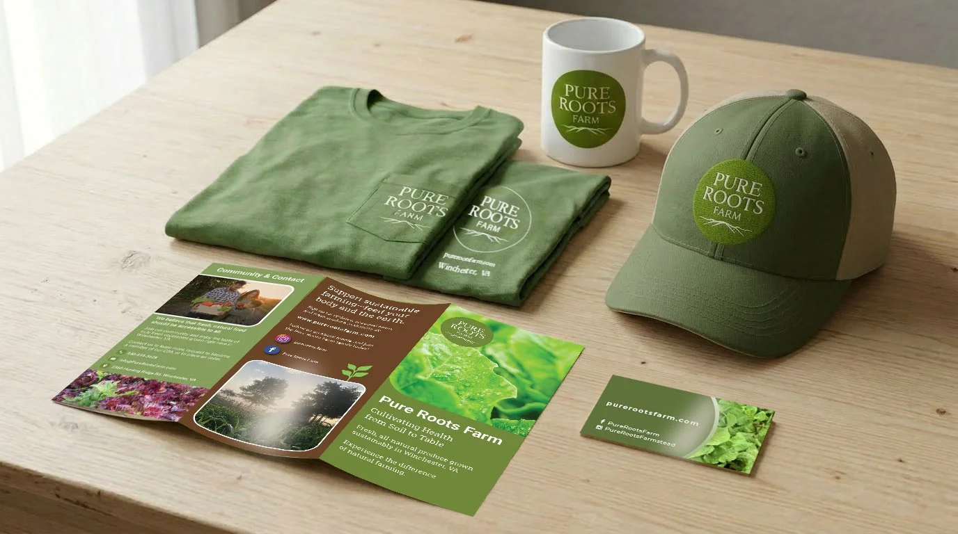 Promotion materials for Pure Roots Farm, including a green T-shirt, a baseball cap, a coffee mug, and informational brochures on a wooden table.