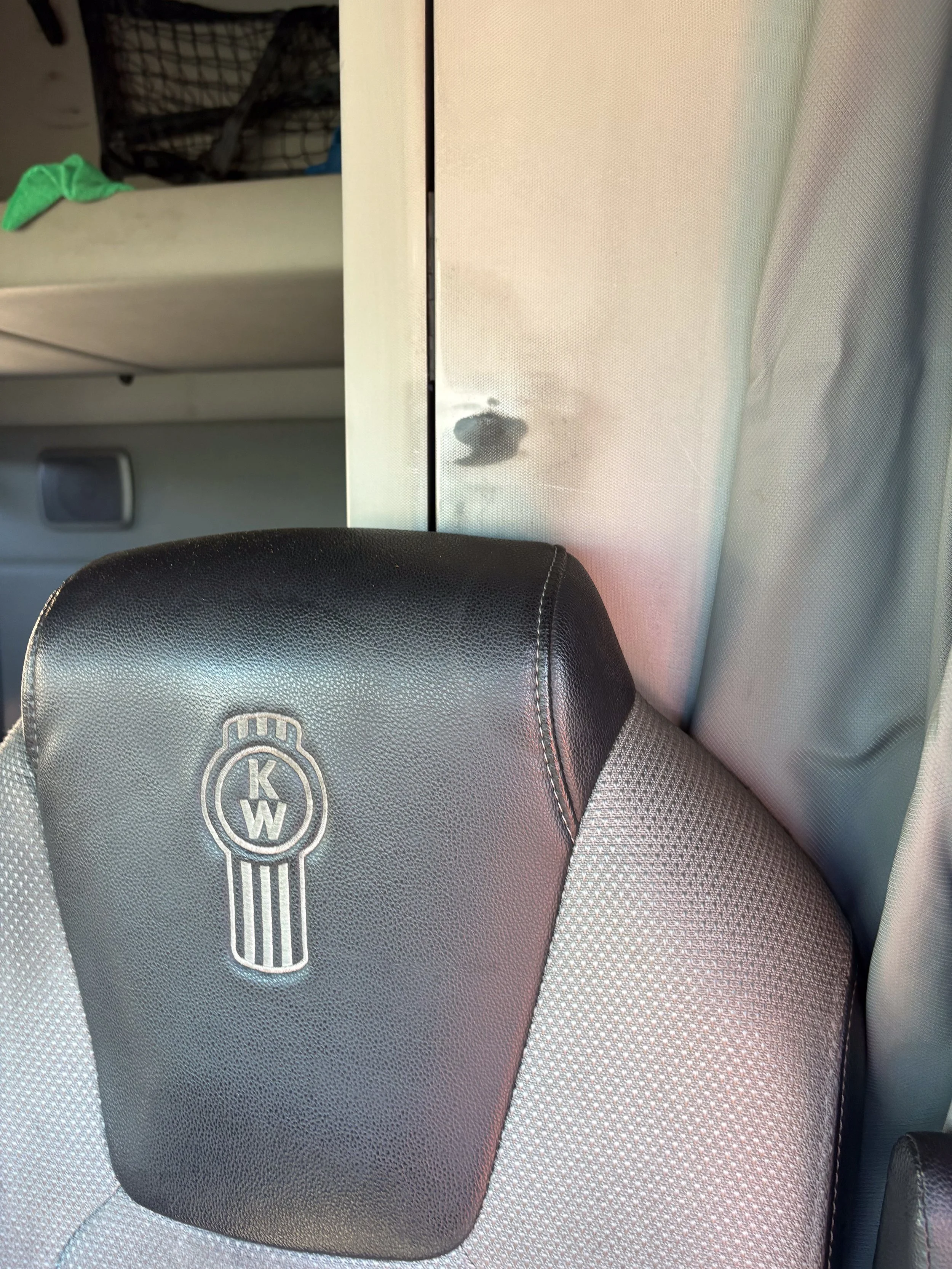 81-blue-kenworth-t680-interior-headrest-closeup.jpg