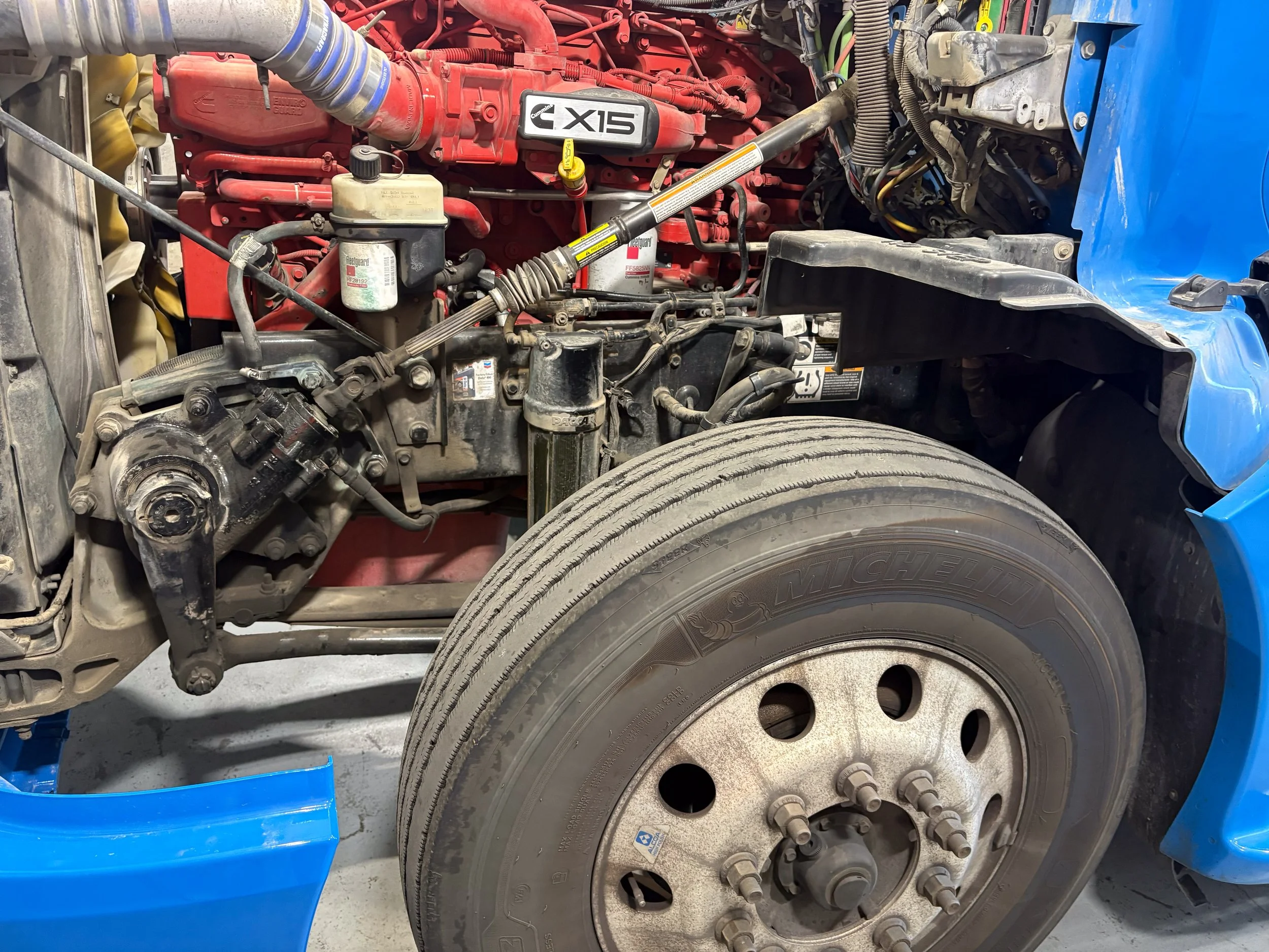70-blue-kenworth-t680-engine-bay-detail.jpg