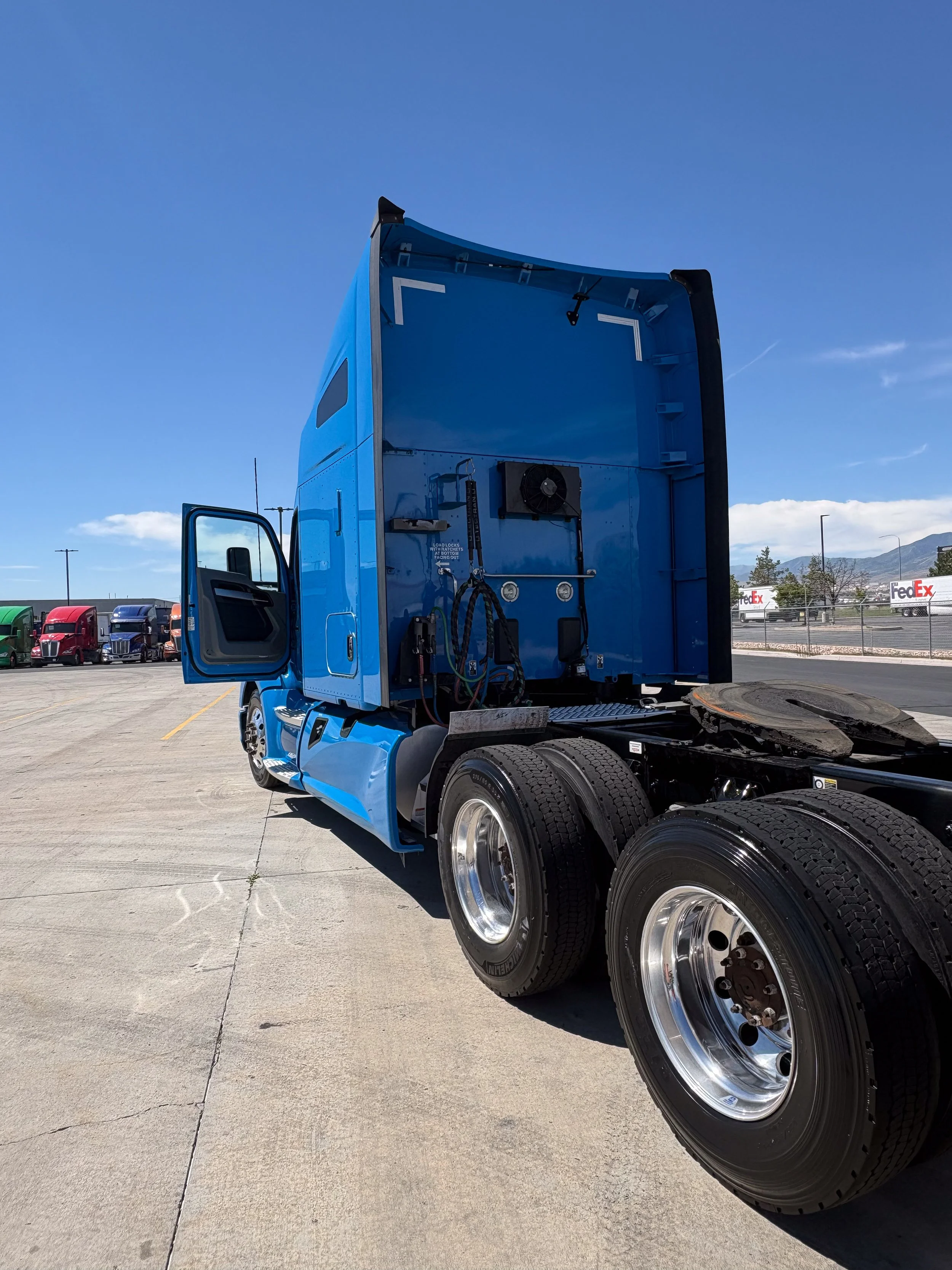 69-blue-kenworth-t680-rear-3q-door-open-after.jpg