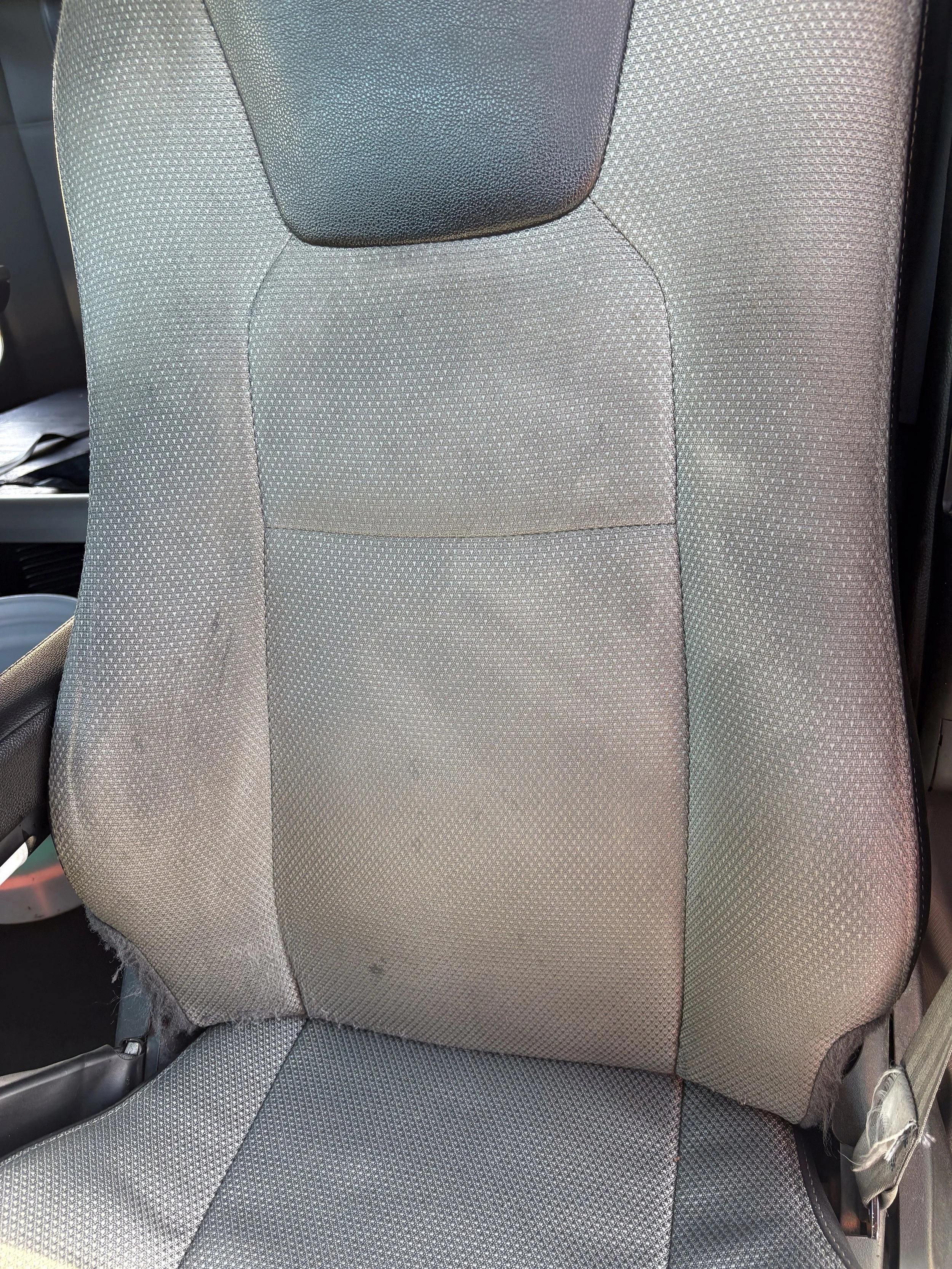 79-blue-kenworth-t680-interior-driver-seat-before.jpg