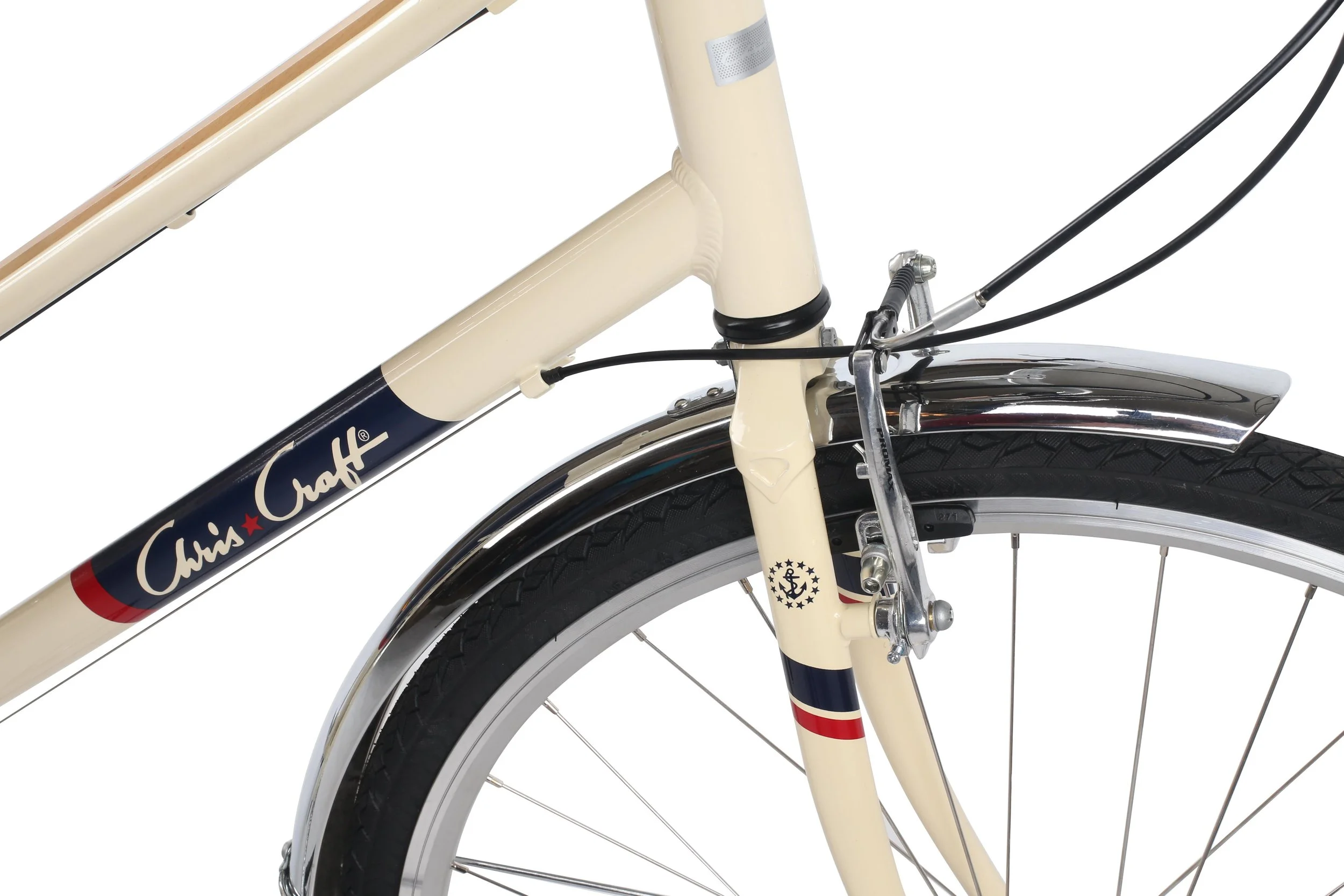 Close-up of a vintage bicycle front wheel, fender, and part of the frame with the brand 'Chris Craft' visible, cream-colored frame with red, white, and blue accents.