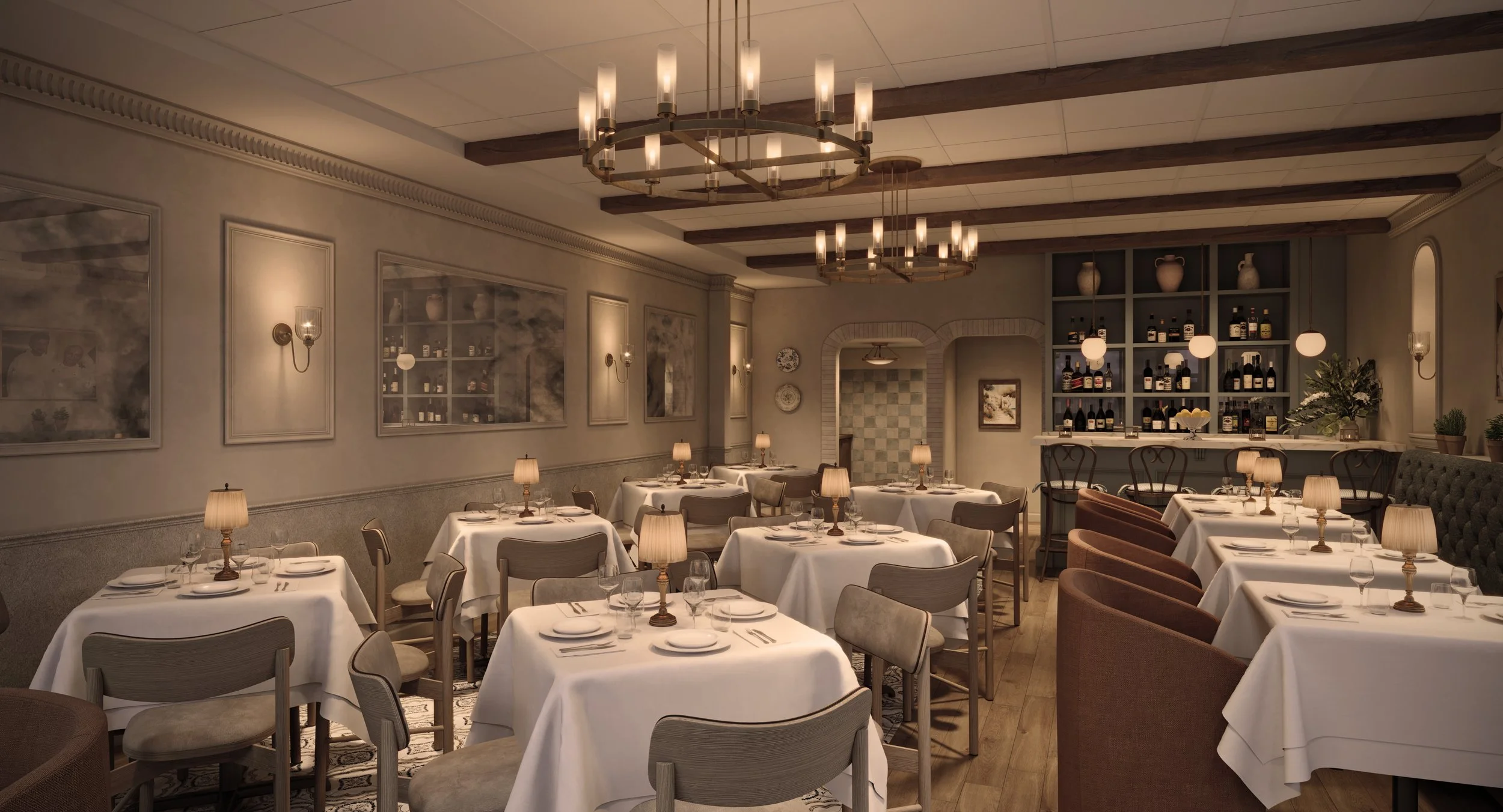 Elegant restaurant dining area with white tablecloths, comfortable chairs, warm lighting, wooden ceiling beams, and a bar with wine bottles and decor.