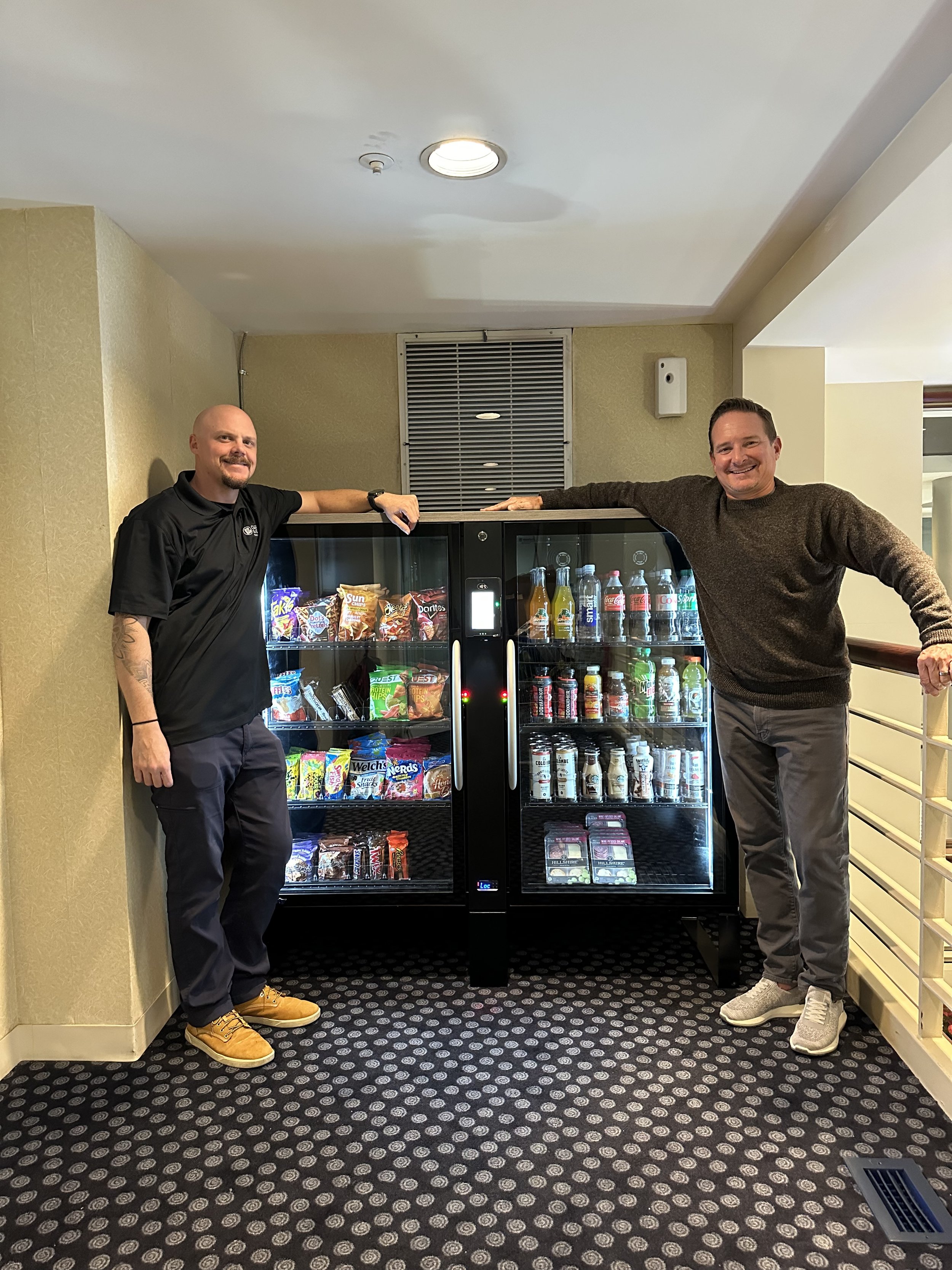 Clean Slate Markets team with a fully stocked smart cooler installation at a New Jersey property