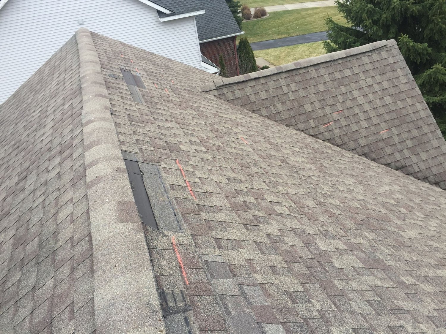 Storm damage to residential roofing