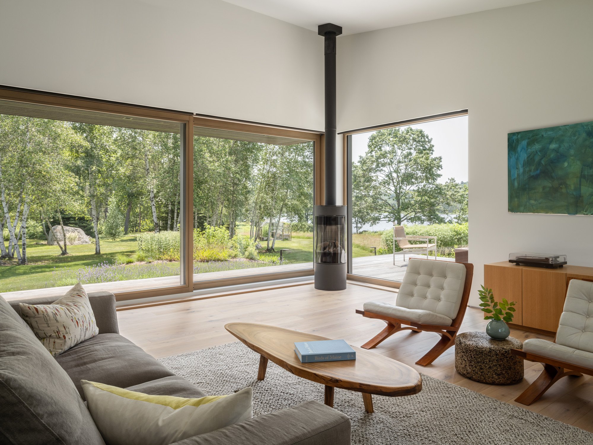 living areas with a bright interior palette of white oak casework and flooring