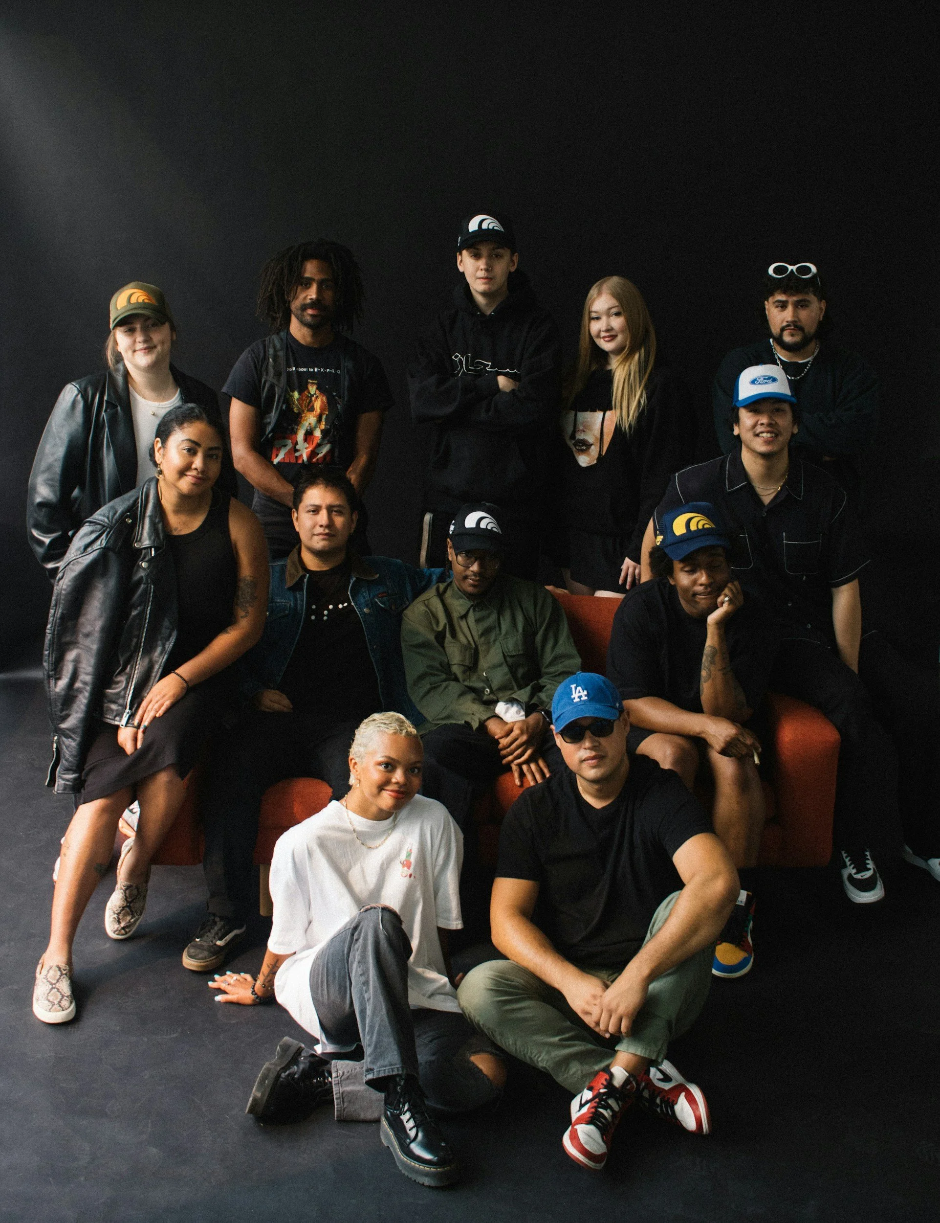 A diverse group of twelve creative millennials working as a team