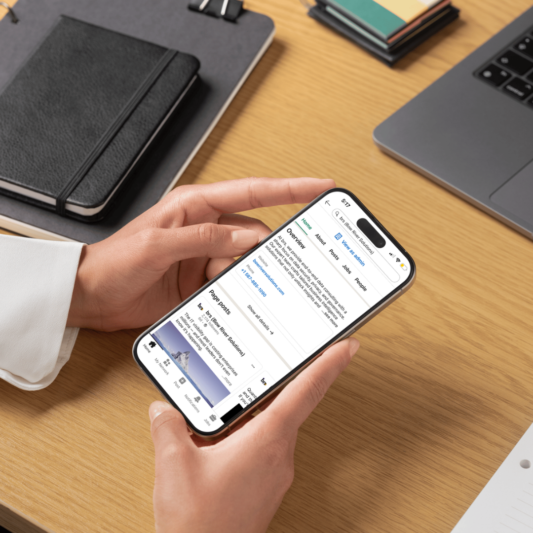 Person holding a smartphone displaying brs LinkedIn company profile