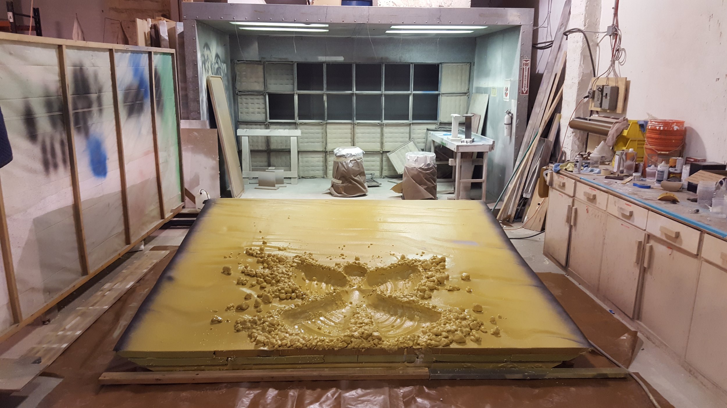 A workspace with a large snow angel sculpture