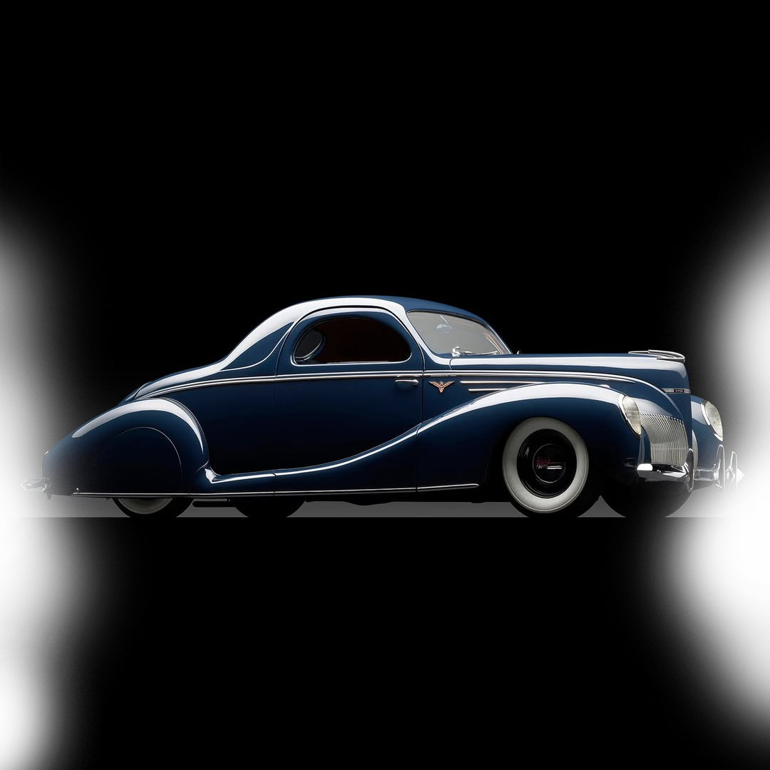 A vintage dark blue luxury car with sleek curves and white wall tires, displayed against a black background.