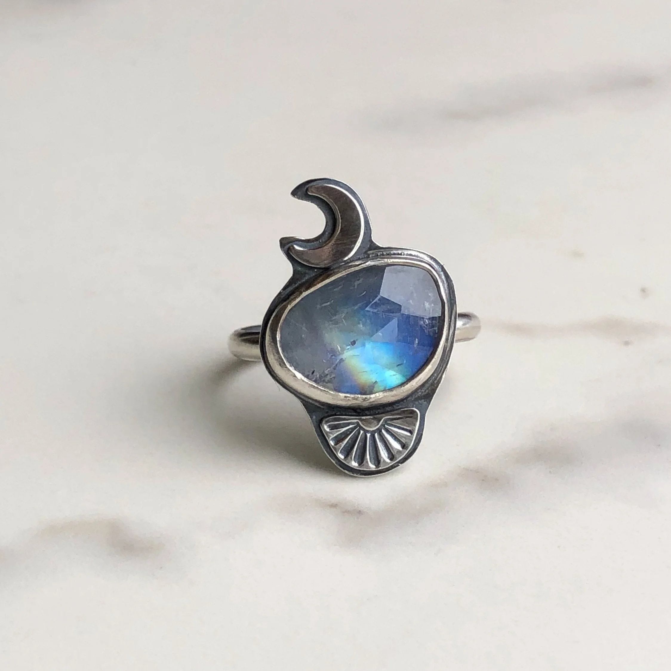 Moonstone ring with crescent and fan accents in silver