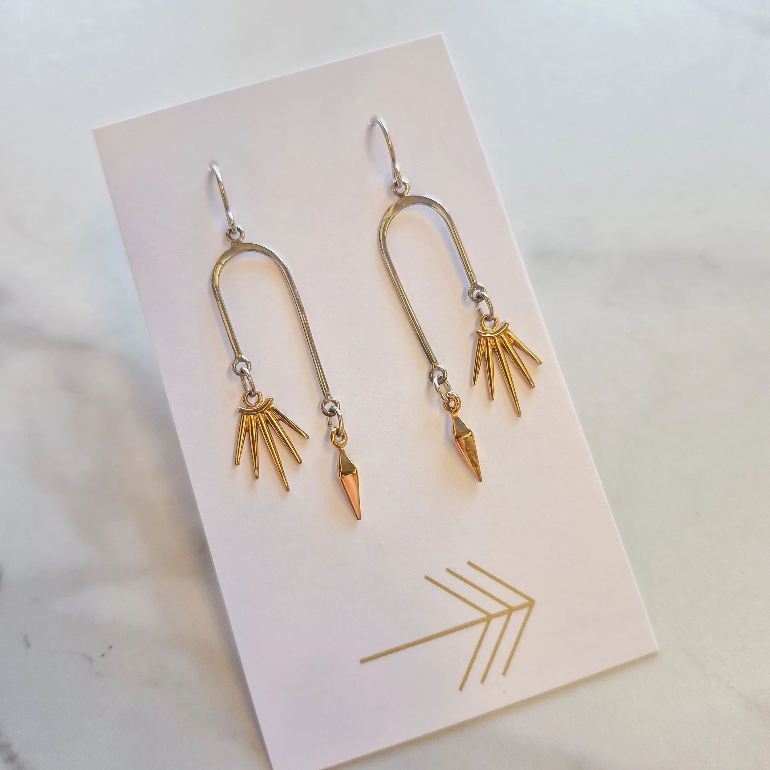 Dagger and Sunburst Asymmetrical Arch Earrings