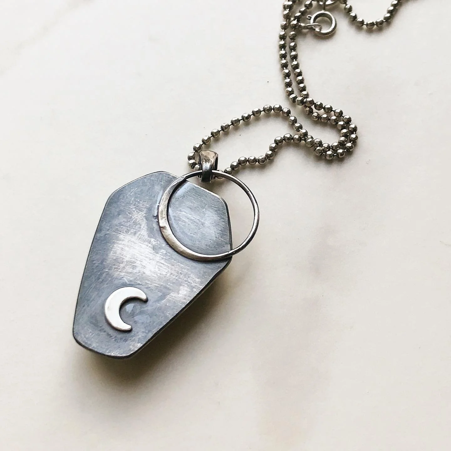 Back detail of coffin necklace