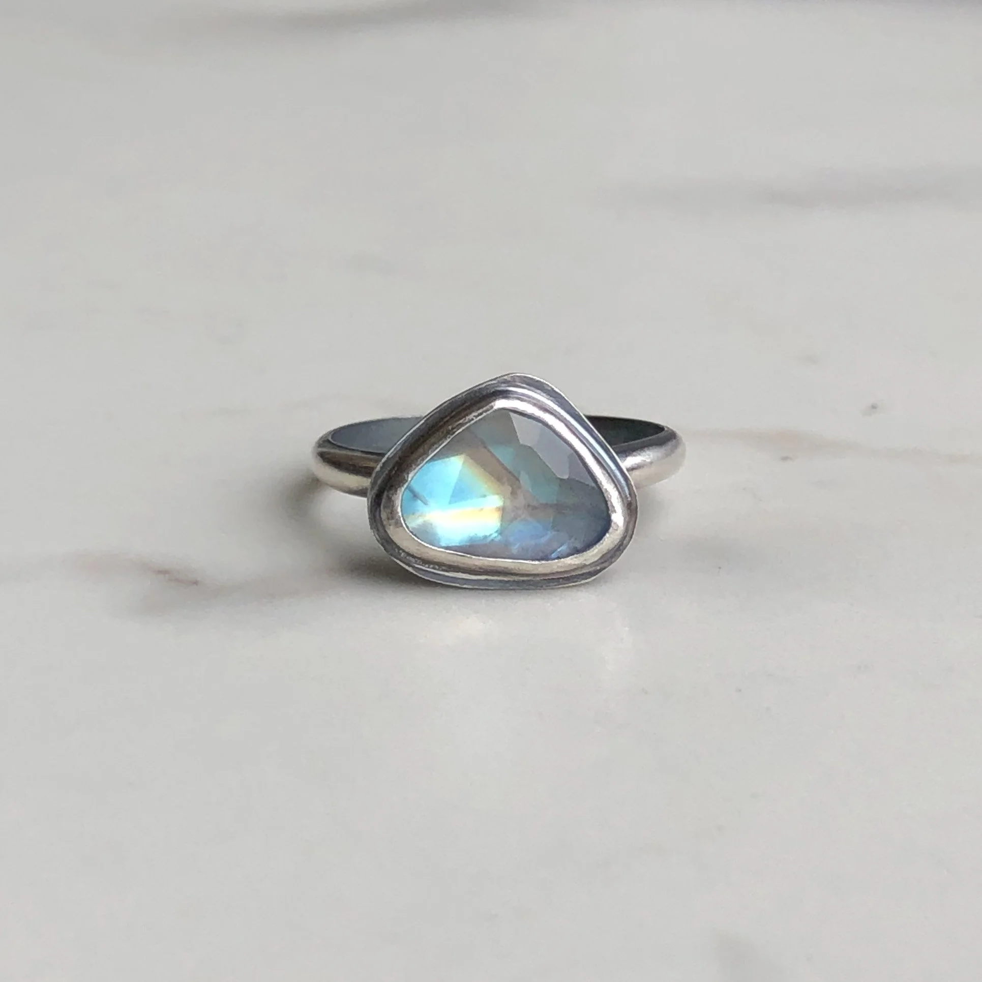 Rounded triangle moonstone ring in silver