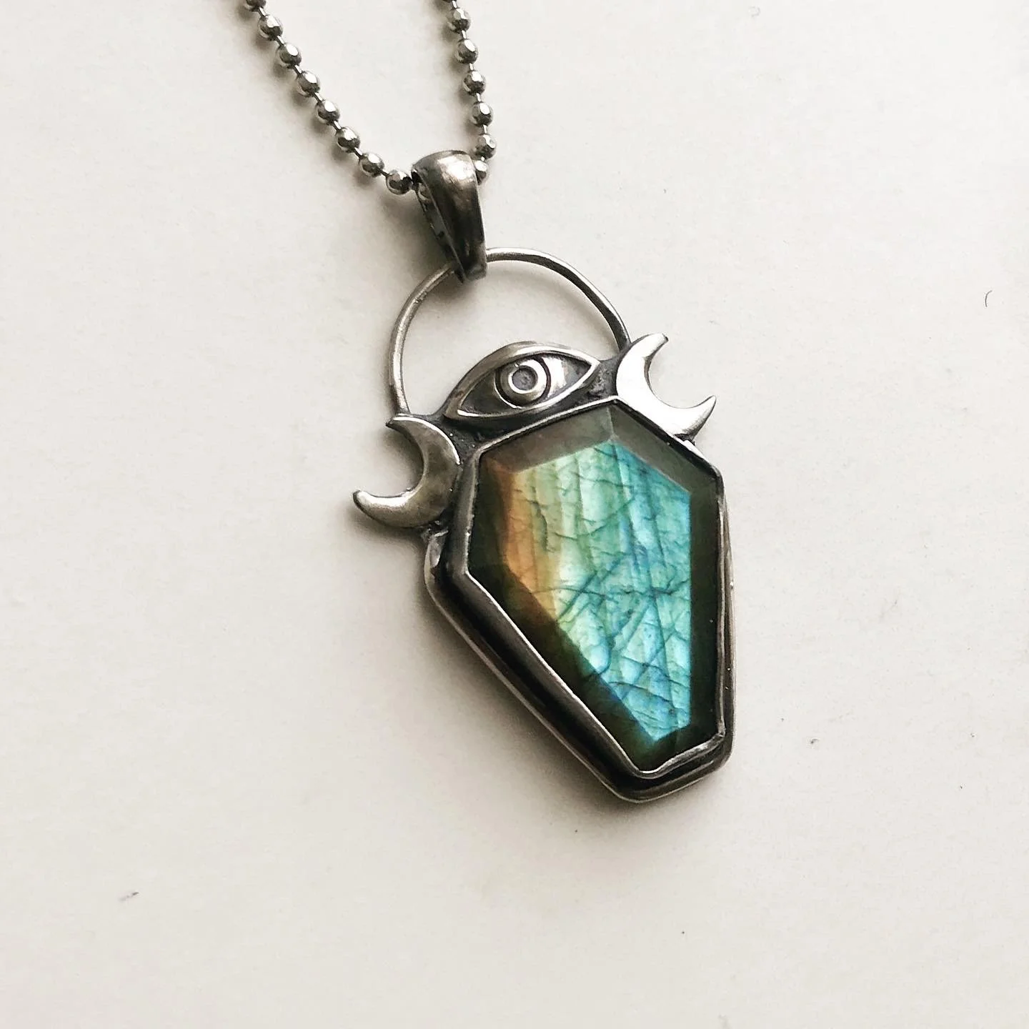 Labradorite coffin necklace in silver with eye & crescents