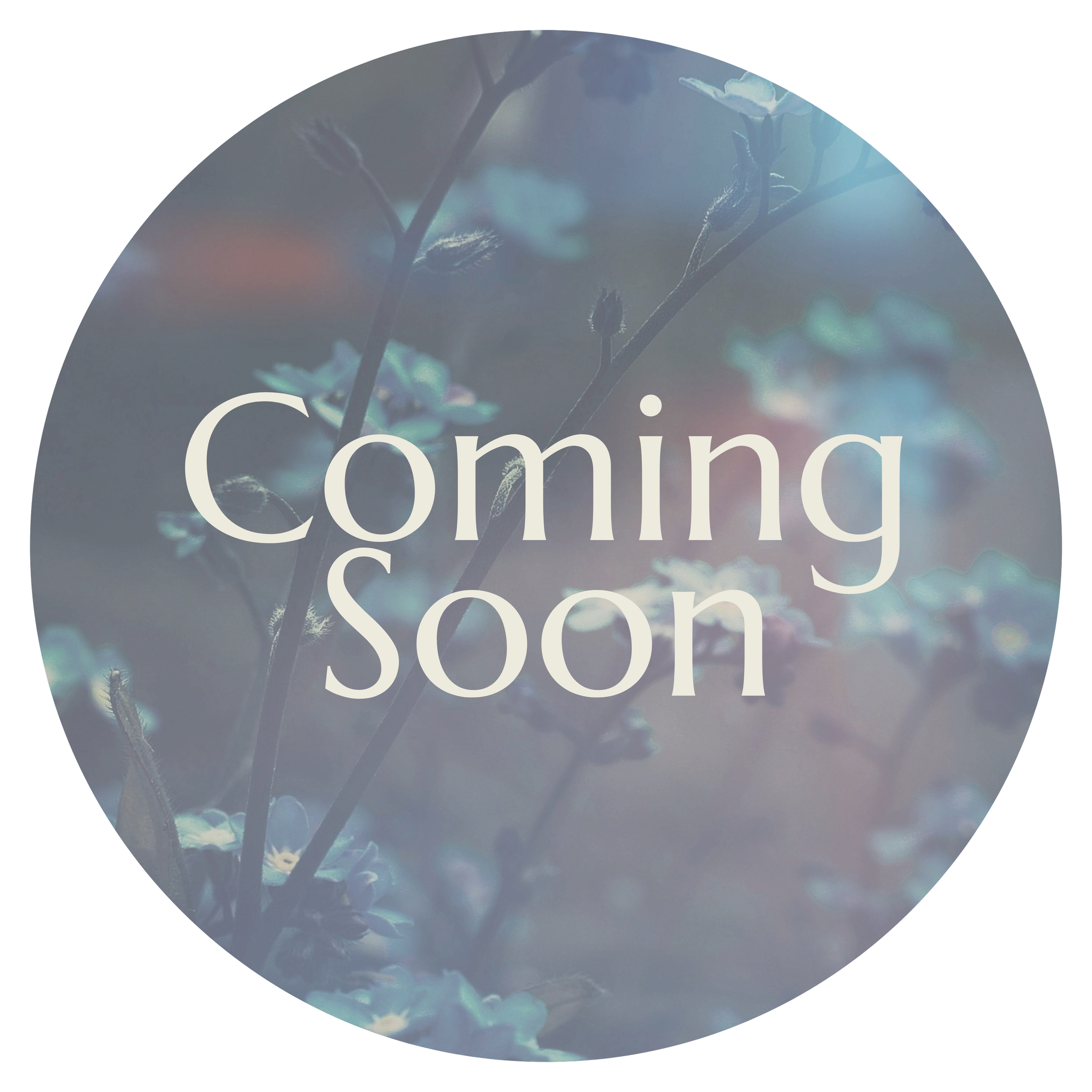 Close-up of blue flowers on a branch against a blurred background, overlaid with the text 'Coming Soon' in white