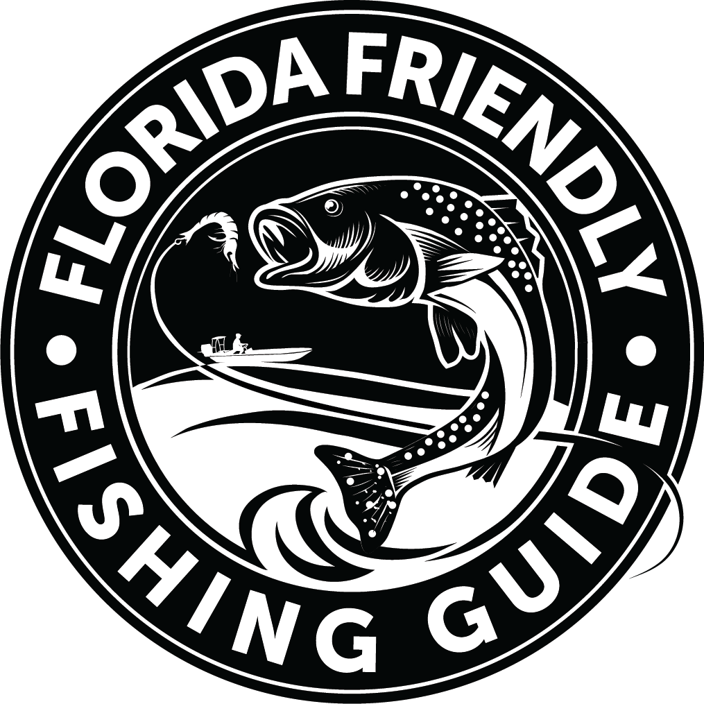 A circular logo with the text 'Florida Friendly Fishing Guide' around the outer edge. Inside, a bass fish is leaping out of the water towards a lure, with a boat and fisherman in the background.