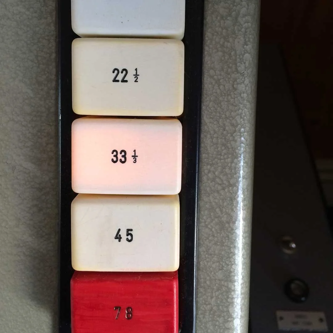 Elevator control panel buttons with labels 22 1/2, 33 1/3, 45, and 78.