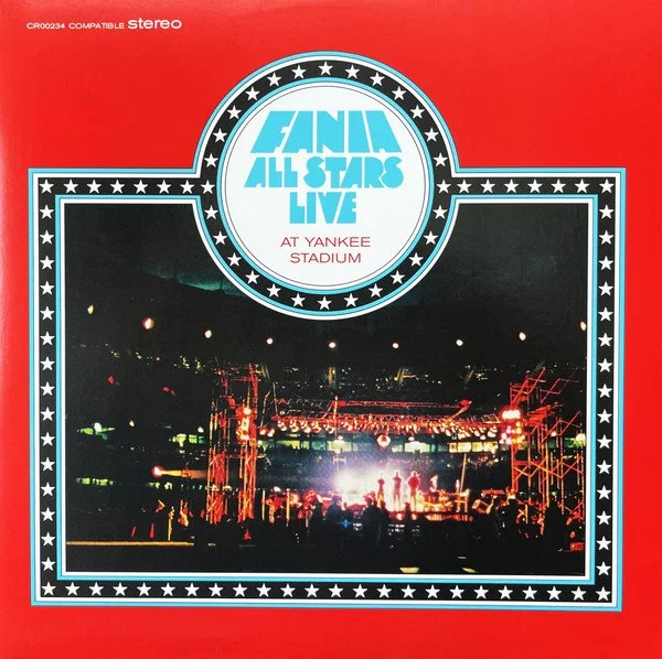 Album cover for 'SDS All Stars Live at Yankee Stadium' featuring a photograph of a concert stage at night with bright lights and silhouettes of the band and audience.