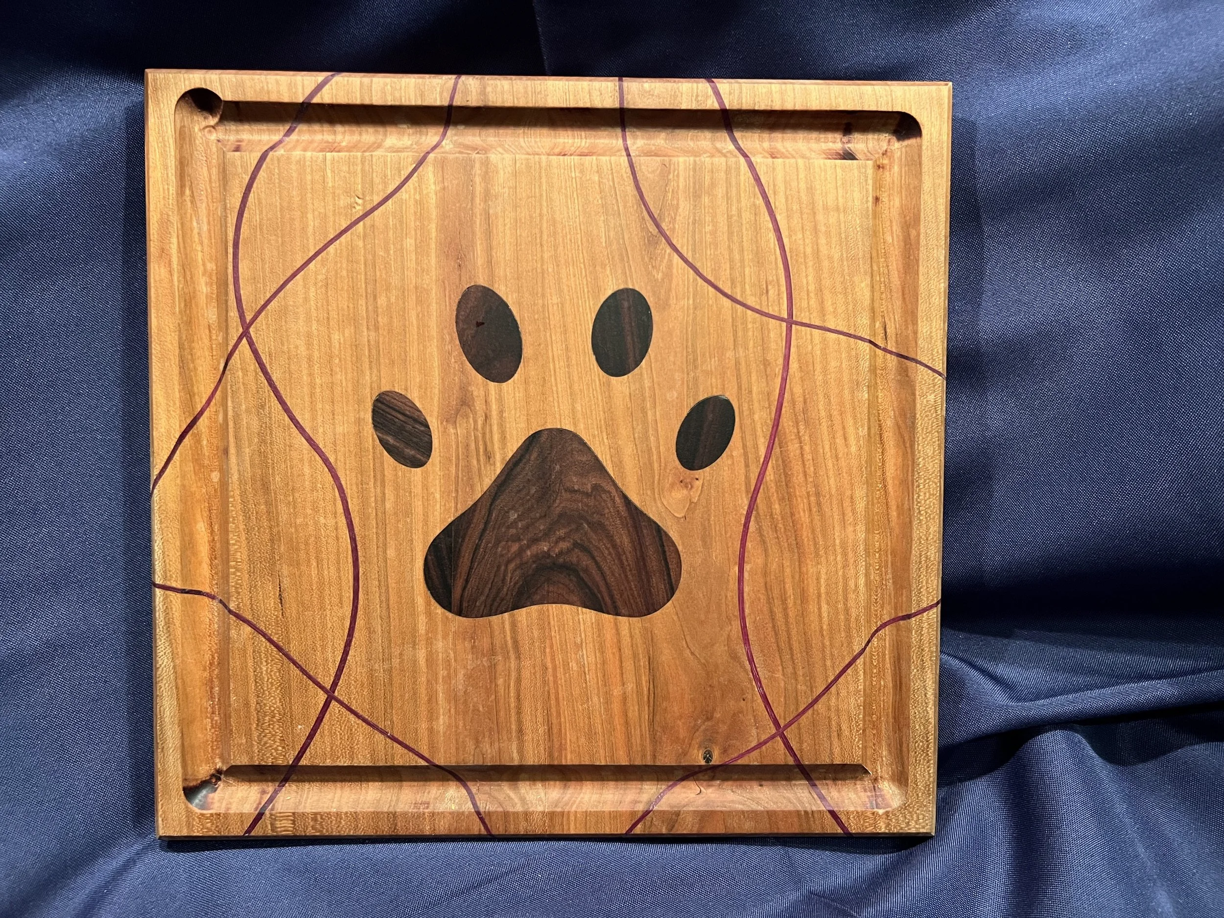 Cherry Cutting board with Purple hart ribbons and a rose wood paw print inlay