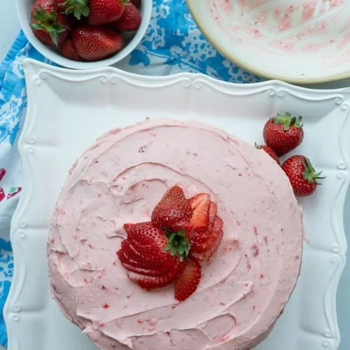 STRAWBERRY CAKE Fresh strawberries mixed into the cake make it exceptionally moist and delicious. Frosting studded with chopped pecans and more strawberries will surely make this a favorite, perfect for a hot summer day.