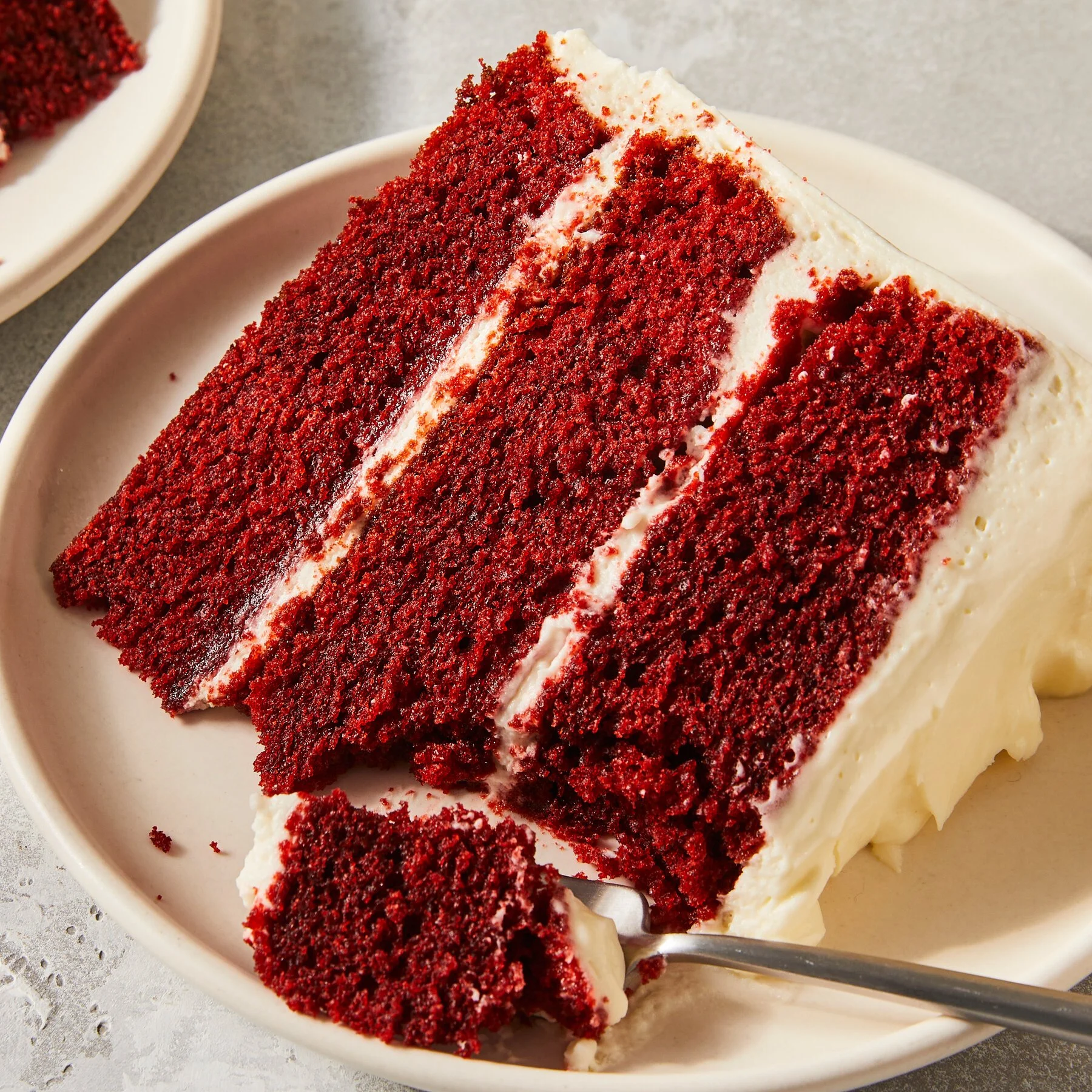 RED VELVET CAKE Three rich layers of beautiful red velvet cake separated by thick layers of delicious cream-cheese frosting. It's sensational with or without the pecan topping — let us know which you prefer.