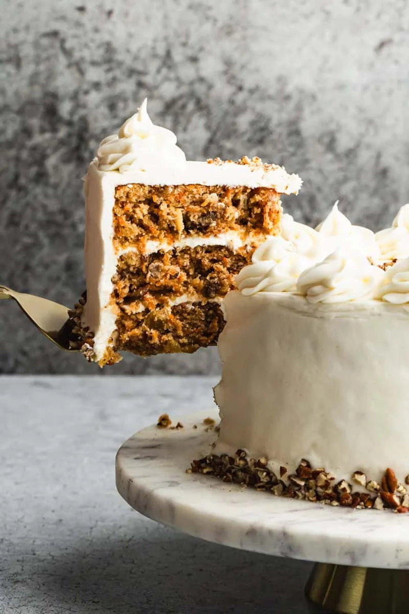 CARROT CAKE We mix freshly grated carrots, sweet coconut, pecans and crushed pineapple into this classic cake and then add   dash of cinnamon. We brush all three layers with a buttermilk glaze before frosting them with the richest of cream-cheese fro