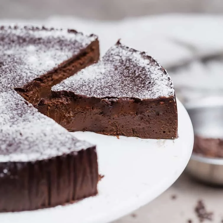 CHOCOLATE FLOURLESS TORTE (GF) Super-rich chocolate cake with tangy raspberry sauce.