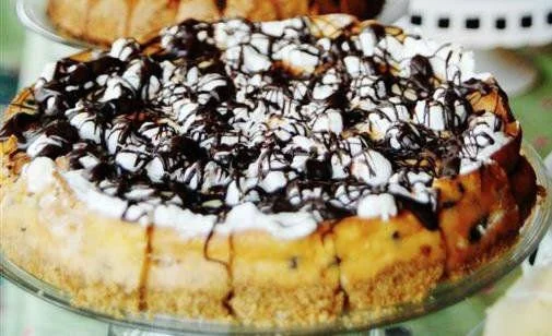 S'MORES CHEESECAKE Don't have time to make s'mores over a campfire? You can always enjoy this cheesecake, filled with chocolate chips and marshmallows in a graham-cracker crust. Drizzled chocolate and melted marshmallows top it all off.