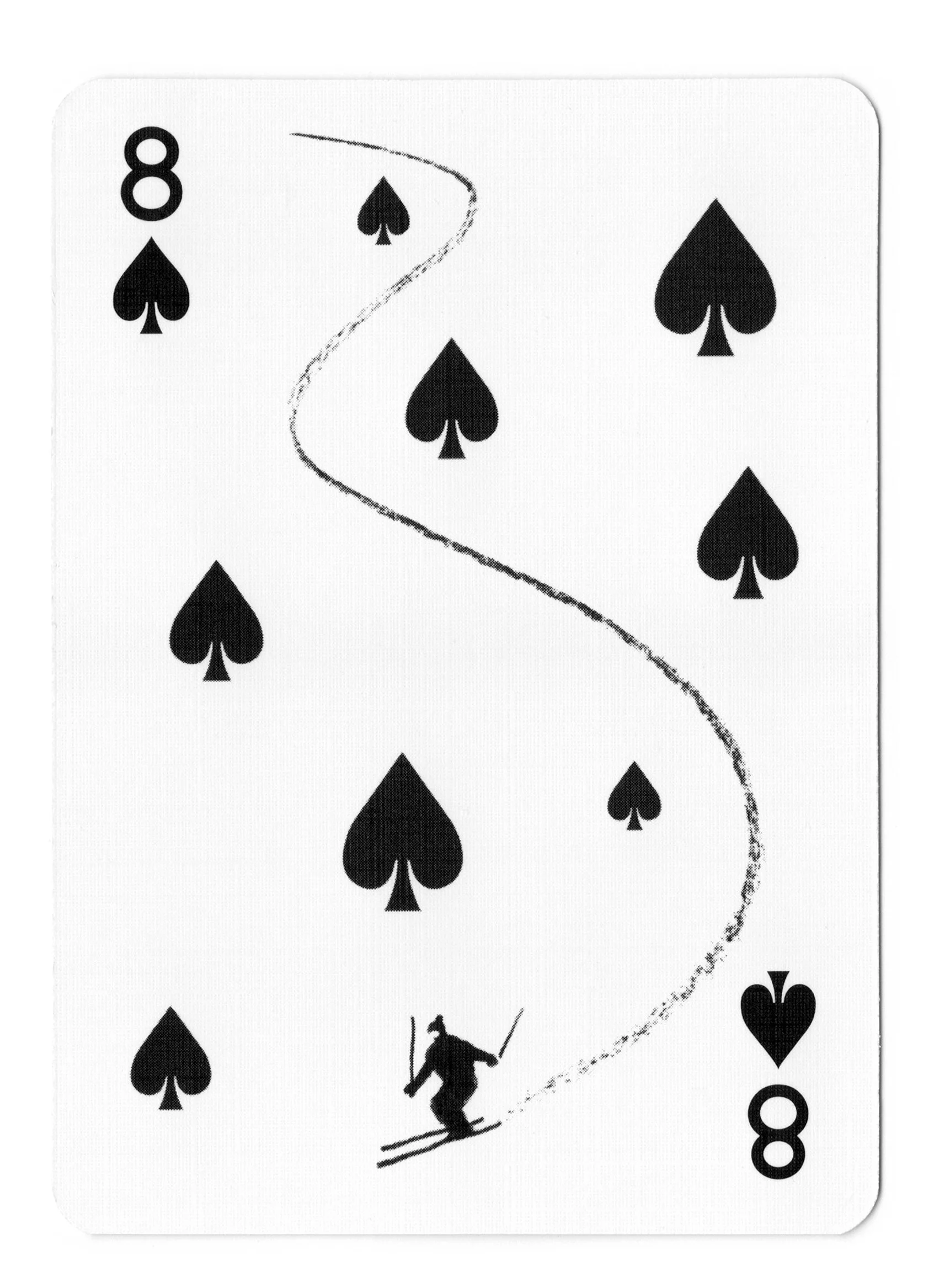 Playing card with an 8 of spades, featuring a black silhouette of a skier at the bottom and a path illustrated as a winding line across the card.