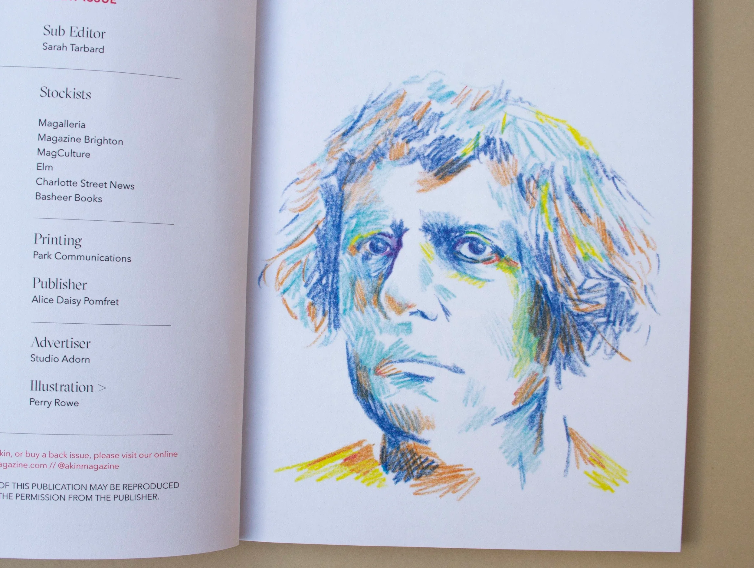 Colorful sketch of a person's face with curly hair, using blue, orange, yellow, and green crayon strokes, on the right side of the image.