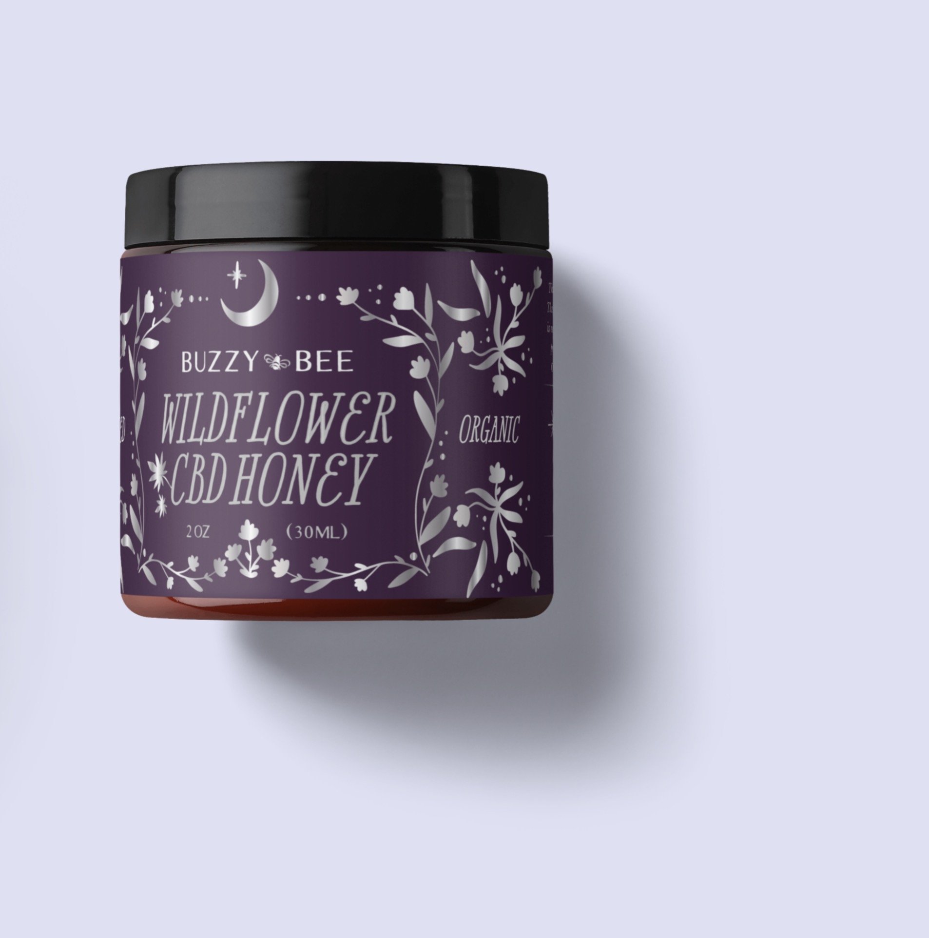 Custom matte BOPP label design for a jar of infused CBD Honey amber glass jar with a black lid, decorated with white floral and celestial designs